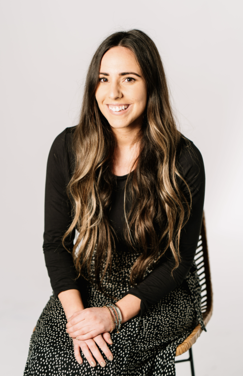 Gabrielle Prater - Real Estate Guide of 6th Ave Homes - sitting on chair