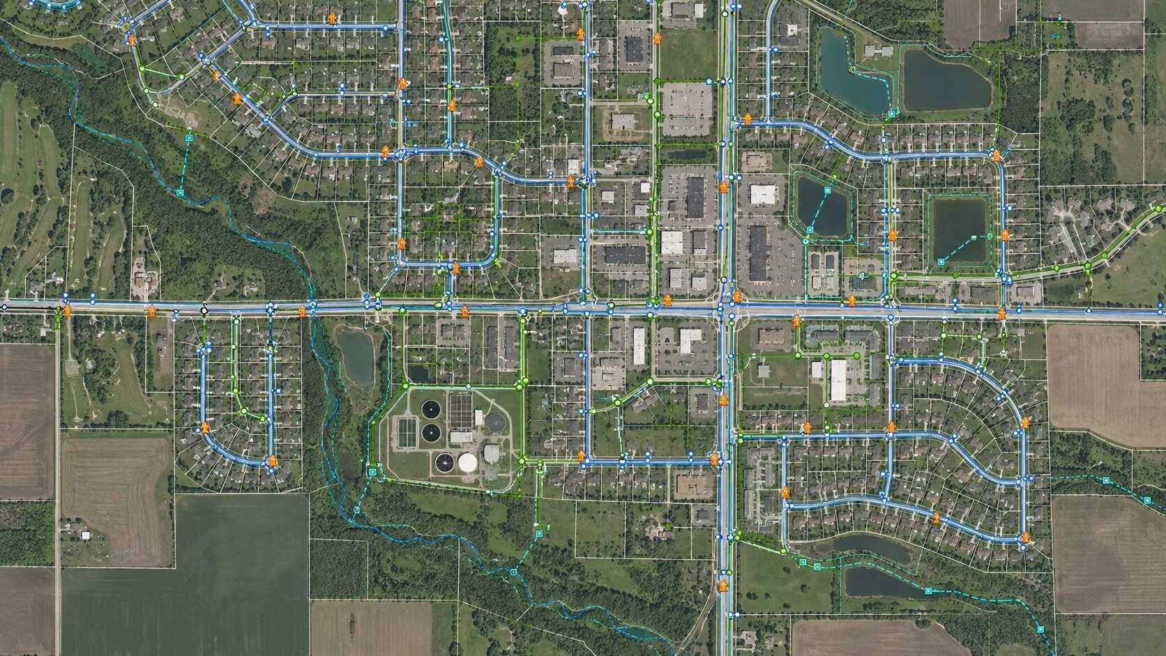 Aerial utility GIS map showing streets, parcels, and infrastructure data overlays.