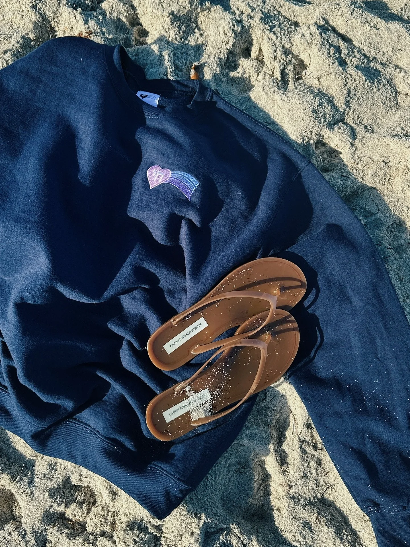 October means it's locals' summer! Staying cozy at the beach in our Lavender + Ice crewneck in navy