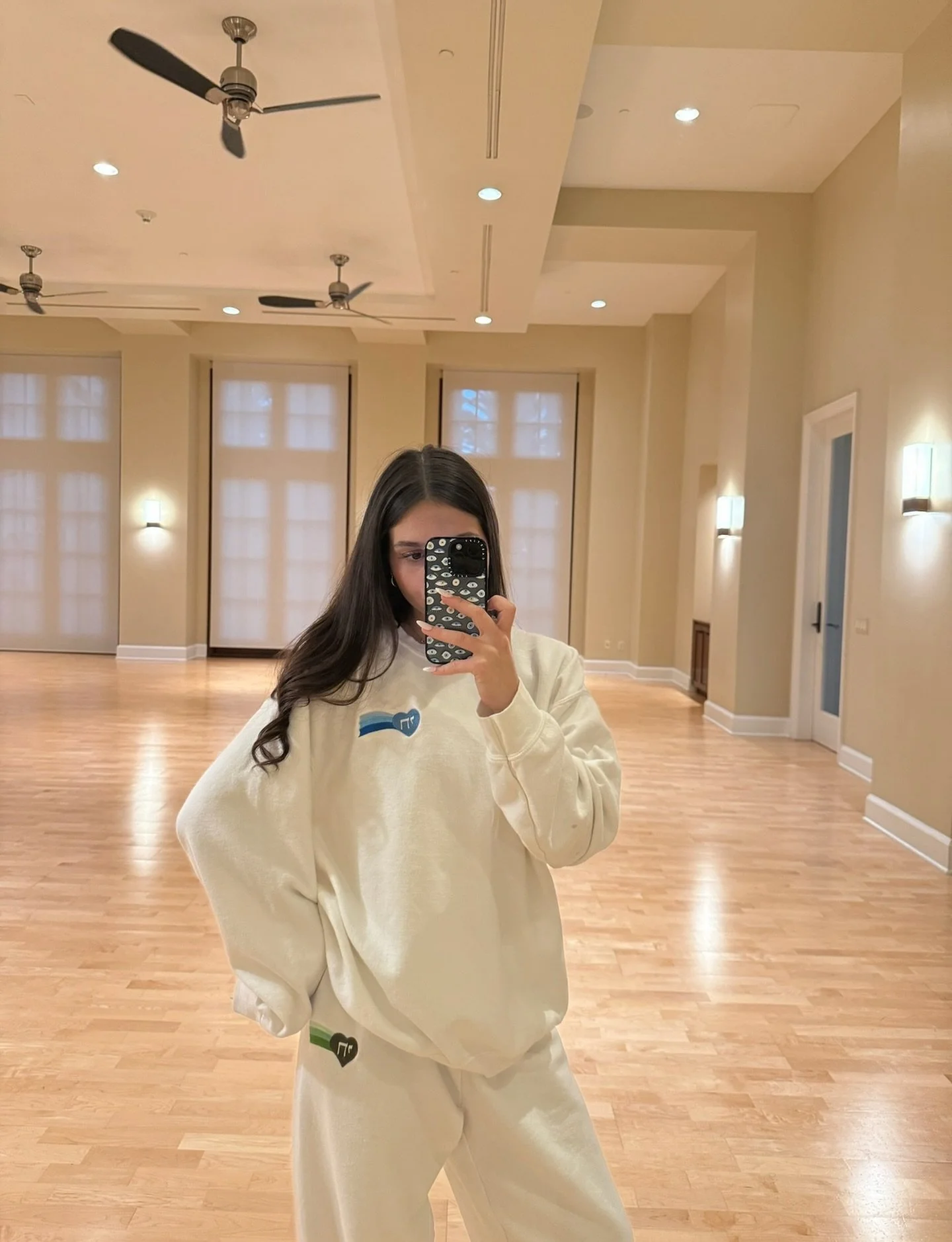 mix + match 🪬 @miaamram in our classic white crewneck and Ometz sweats, link in stories to shop