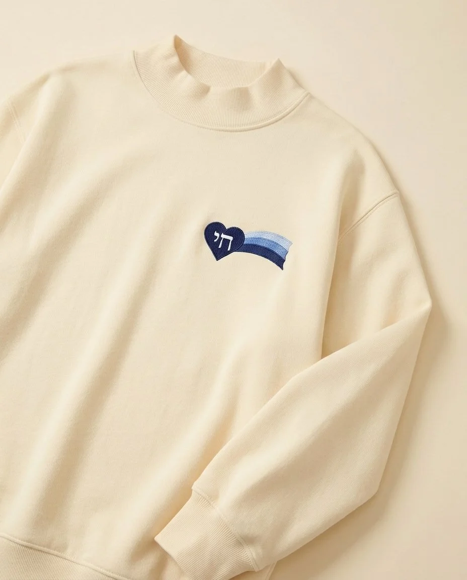 replace_the_yellow_emroidered_patch_with_a_navy_emroidered_patch_on_the_butter_yellow_mockneck__ebd77168-326f-4dbe-ab53-5d9003894b2d.jpeg