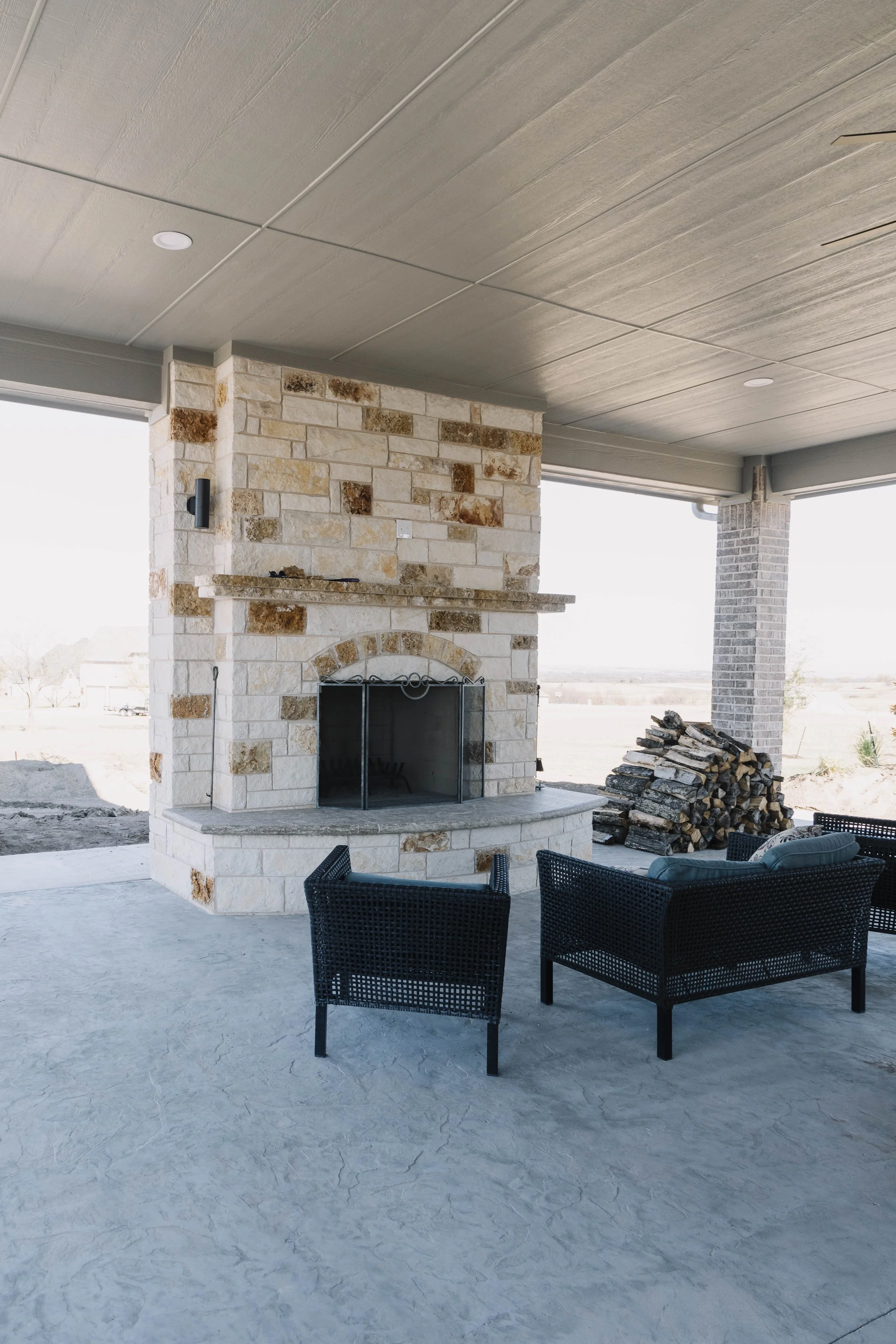 Gigantic outdoor fireplace built by 6th Ave Homes