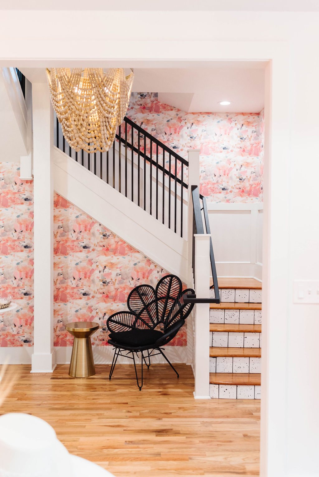 Colorful  staircase with modern chair and Chandeliers