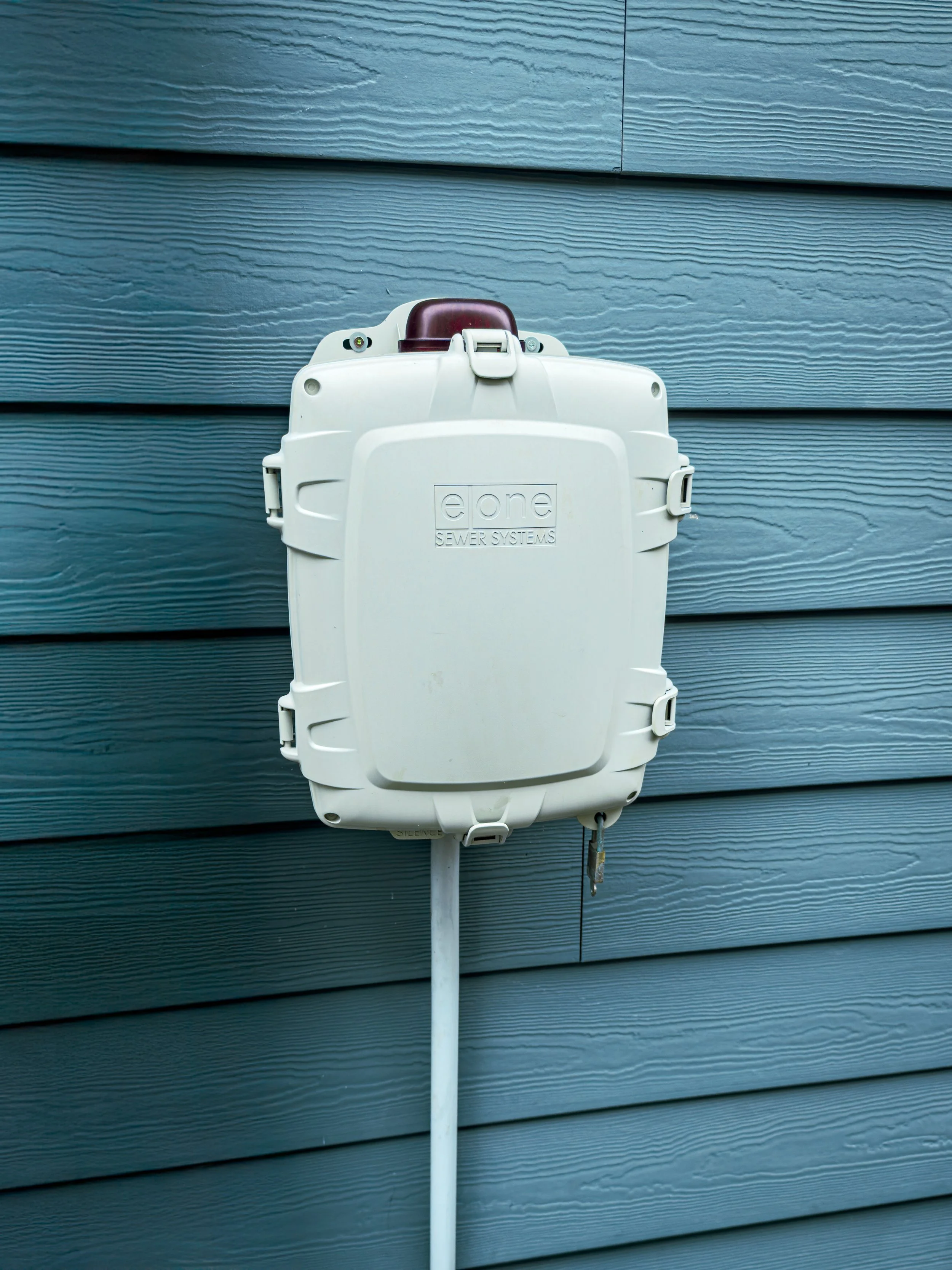Pump system used in a pressure sewer setup E-One grinder pump control panel mounted