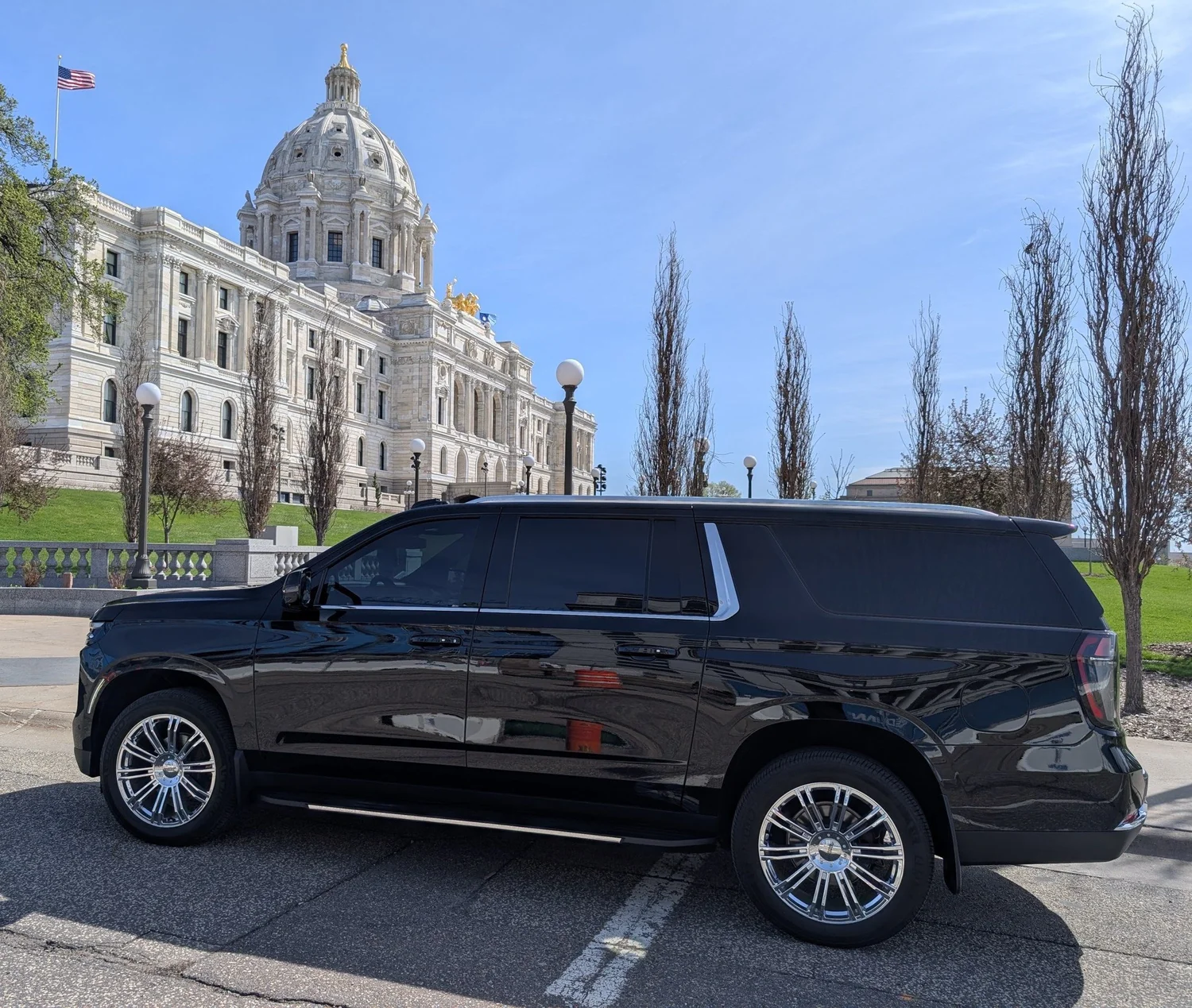 Black chauffeur-driven Chevrolet Suburban in front of the Minnesota State Capitol in St. Paul