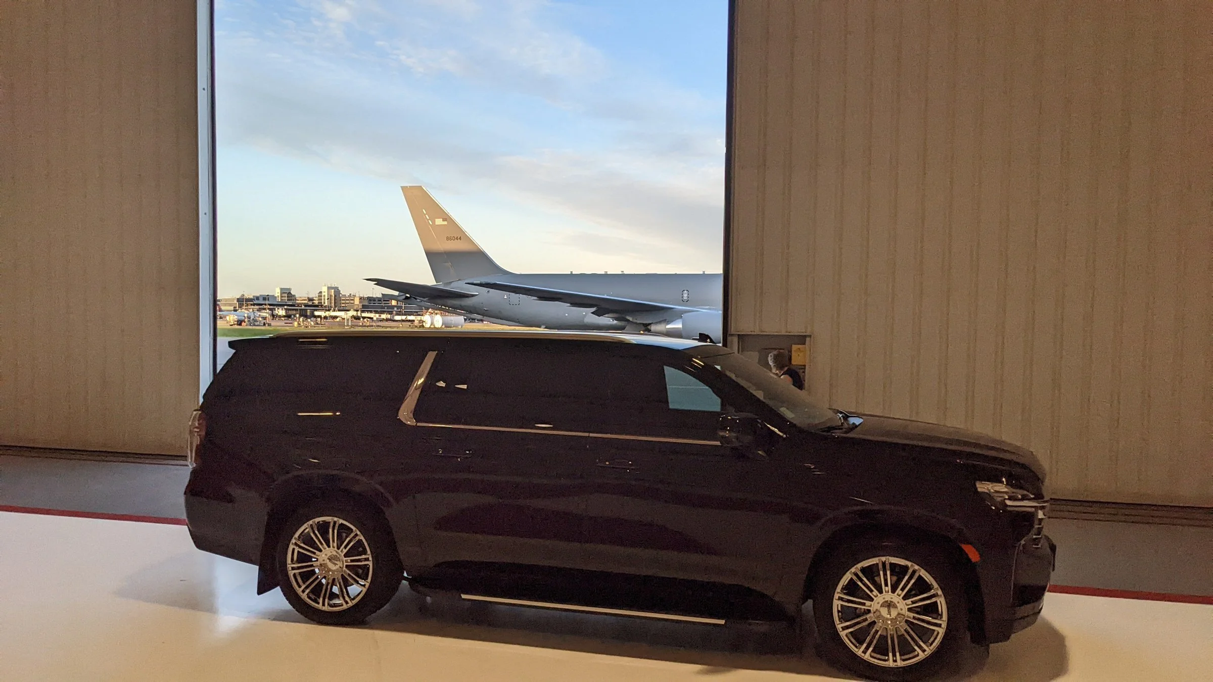 For Sure Luxury Suburban in an aircraft hangar at MSP Airport for airport and private aviation car service