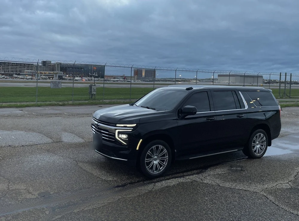 Black Suburban beside the airfield at MSP Airport