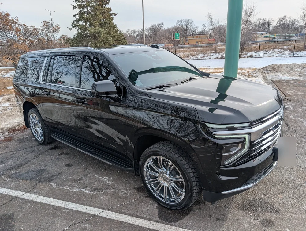 Black chauffeur SUV ready for a point-to-point transfer in Minnesota