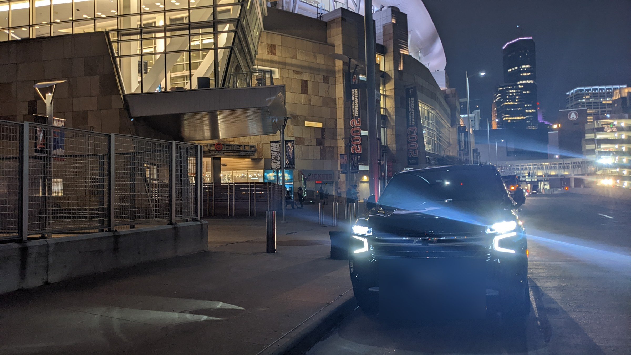 For Sure Luxury Suburban arriving at Target Center at night in downtown Minneapolis
