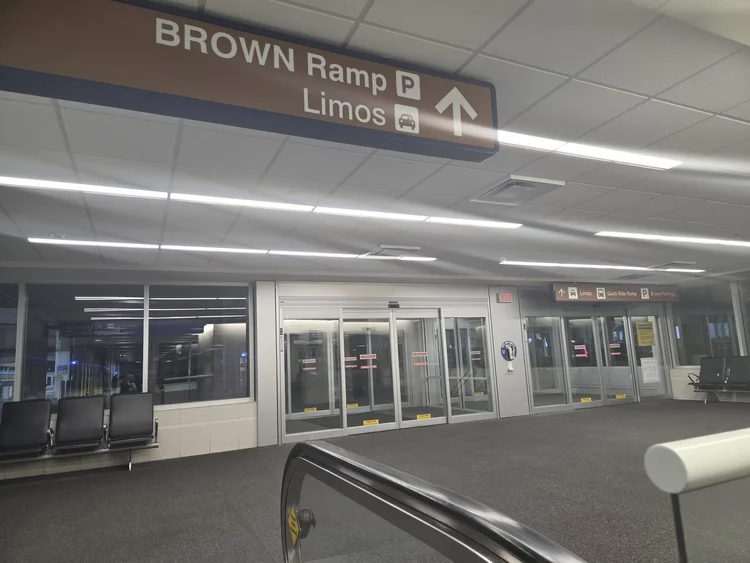 Brown Ramp limo lobby at the top of the escalator at MSP Terminal 1, where your chauffeur waits