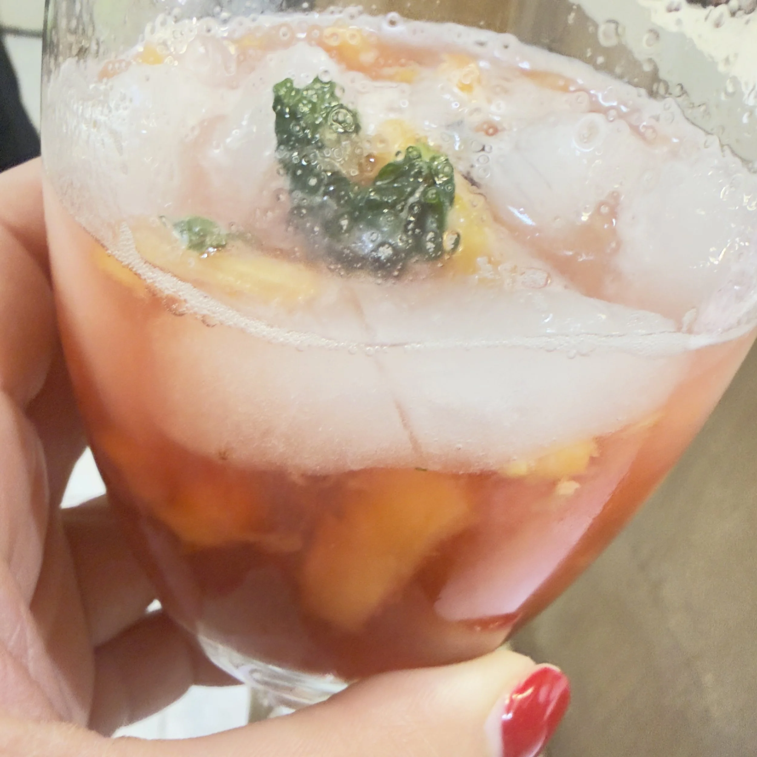 Raspberry Kiss Cocktail, muddled mint, pineapple, raspberry., vodka.