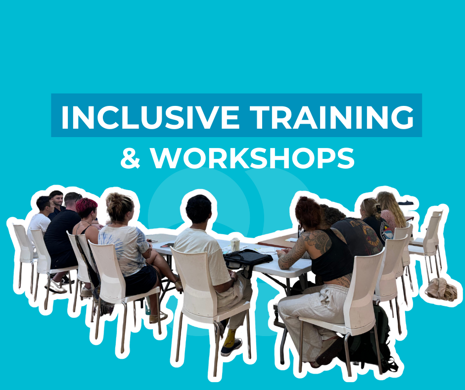 Group of diverse individuals attending an inclusive training workshop at a long table with chairs on a blue background