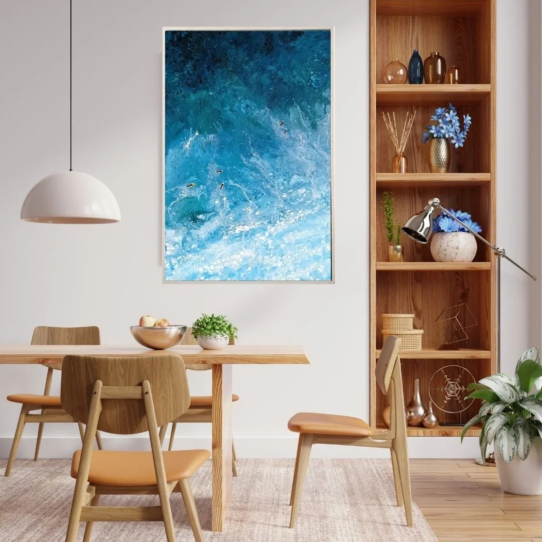 Ocean painting with surfers in dining room