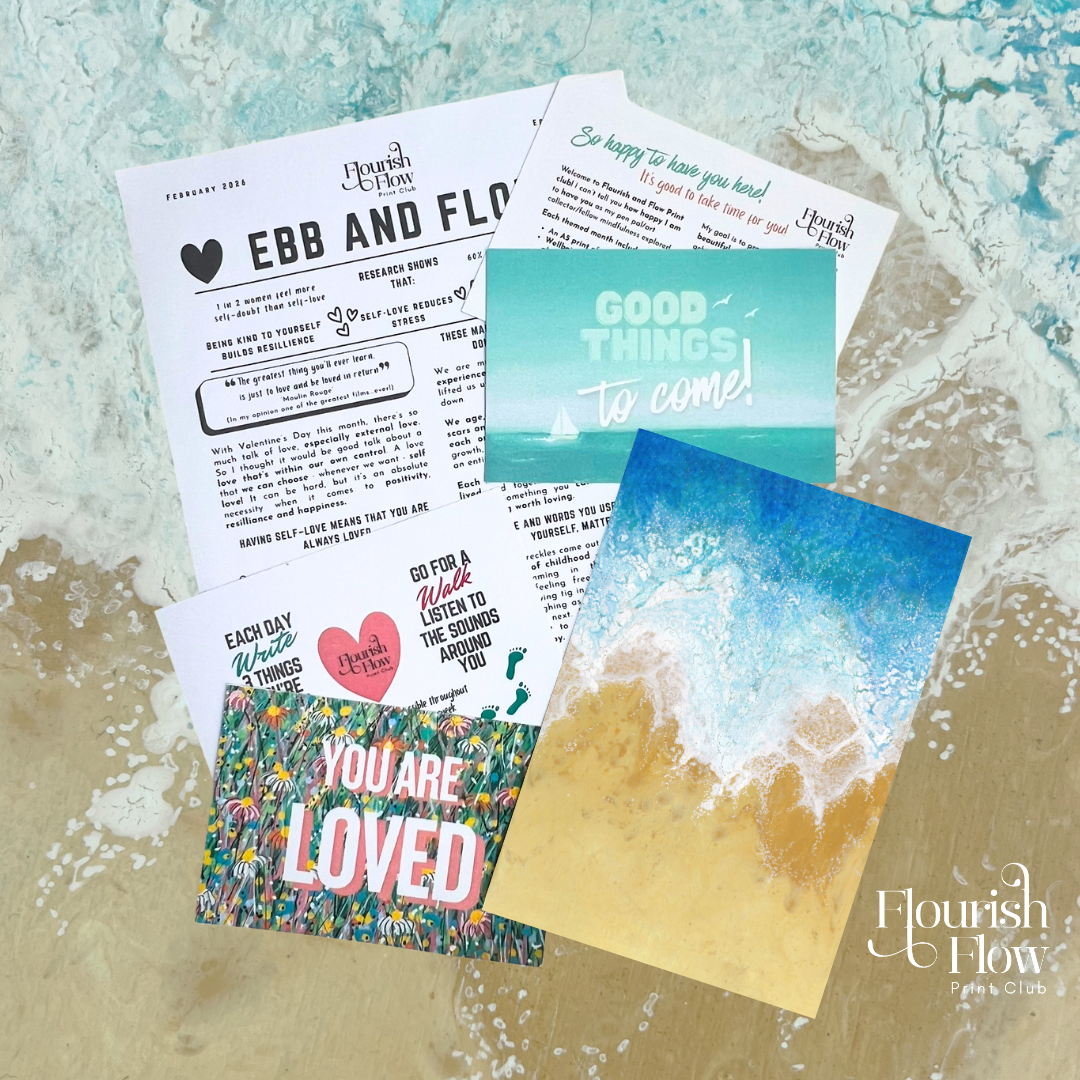 A collection of printed papers and cards spread out on a table, including motivational quotes, event information for Flourish & Flow, and colorful beach-themed postcards with waves and a sailboat.