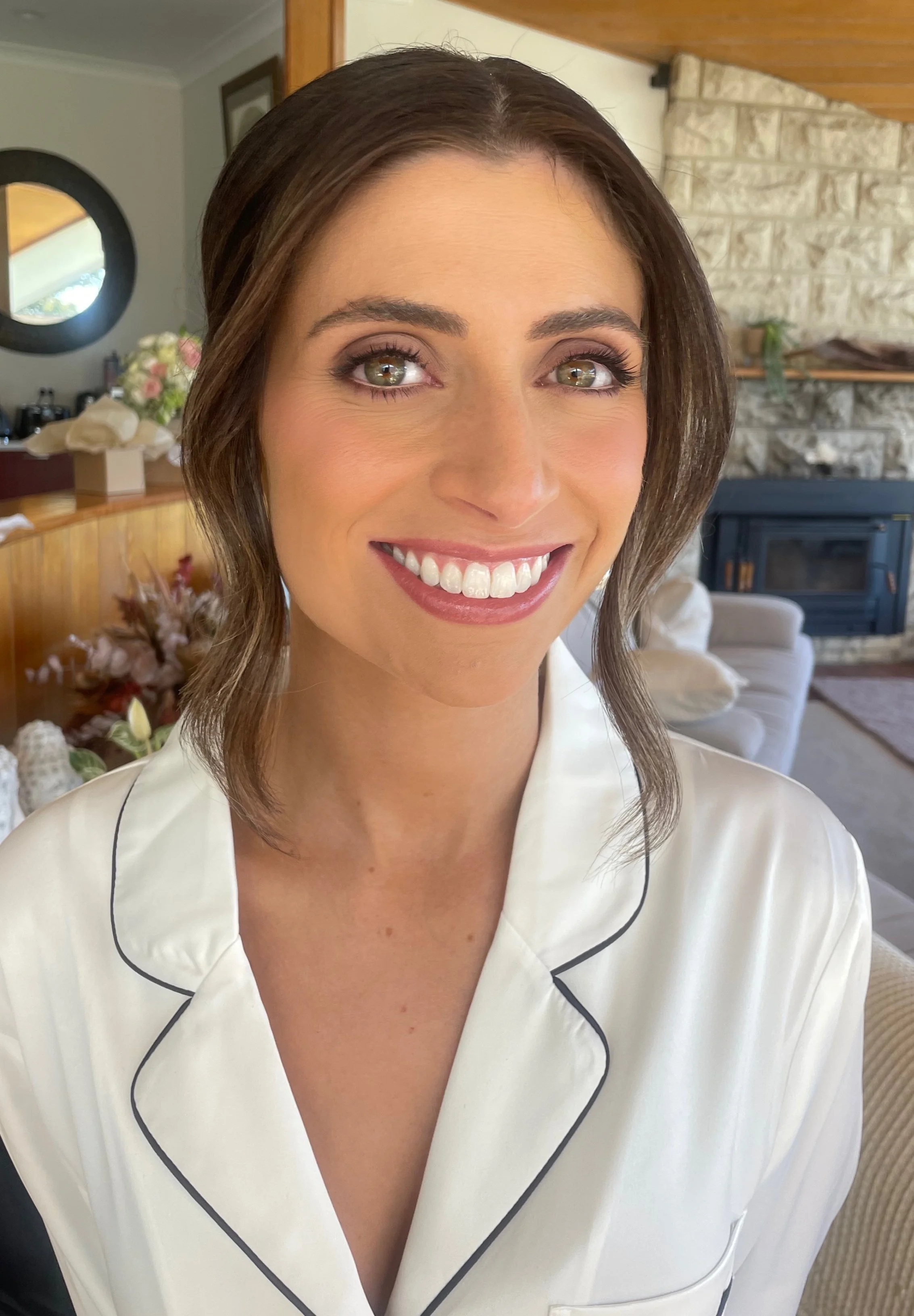 smiling bride after having professional makeup applied