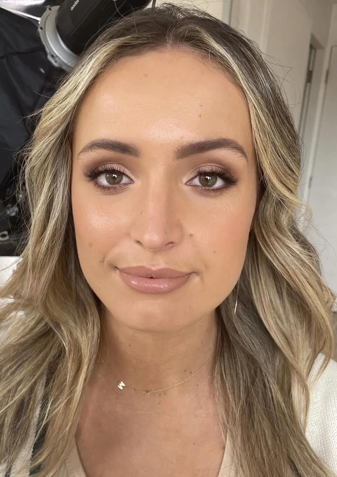 Face of a young woman who has had makeup applied by a professional Jessica O'Donnell. The look is fresh and natural