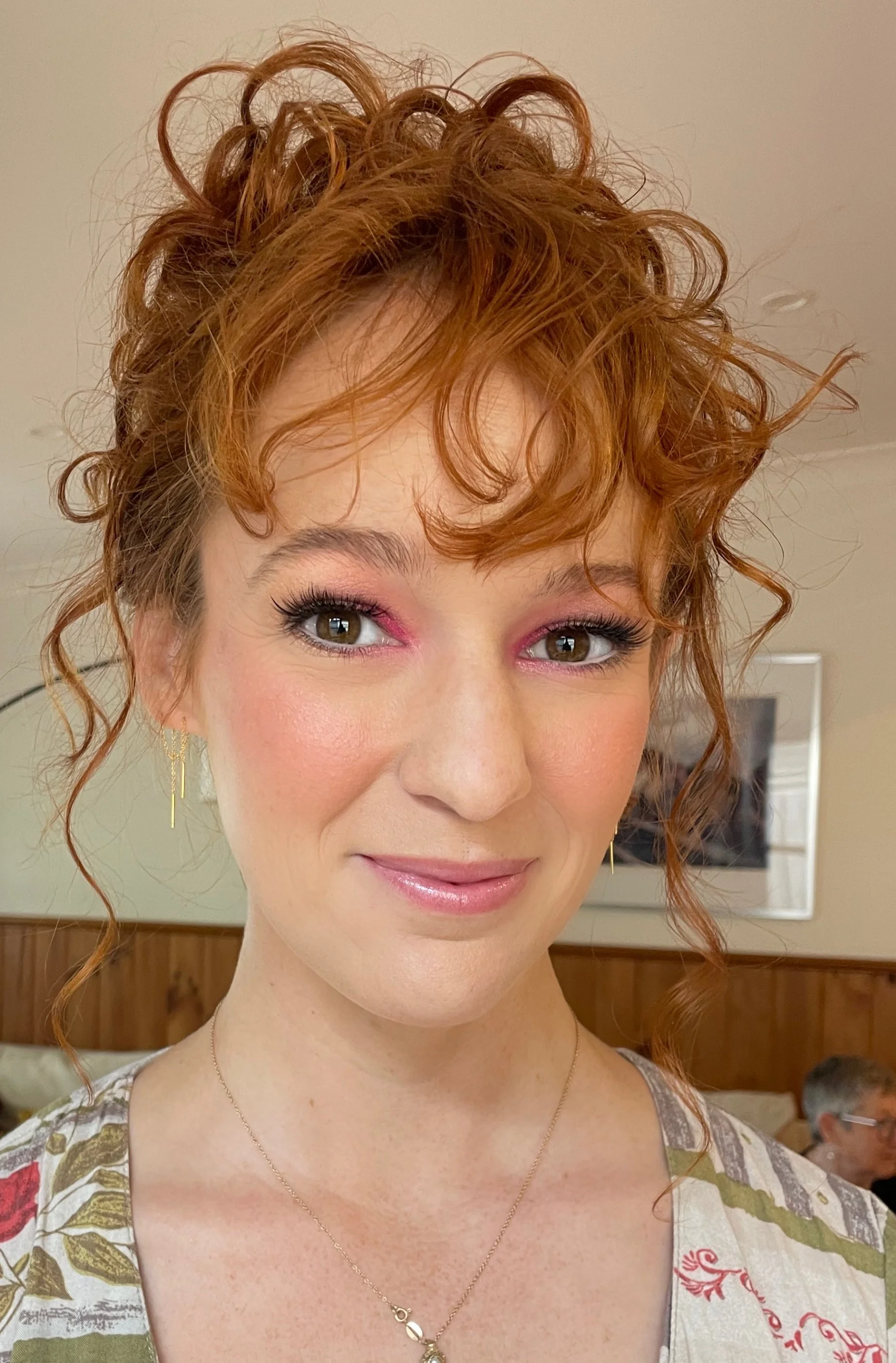 Falling curls and lightly applied makeup for this young woman attending a school formal