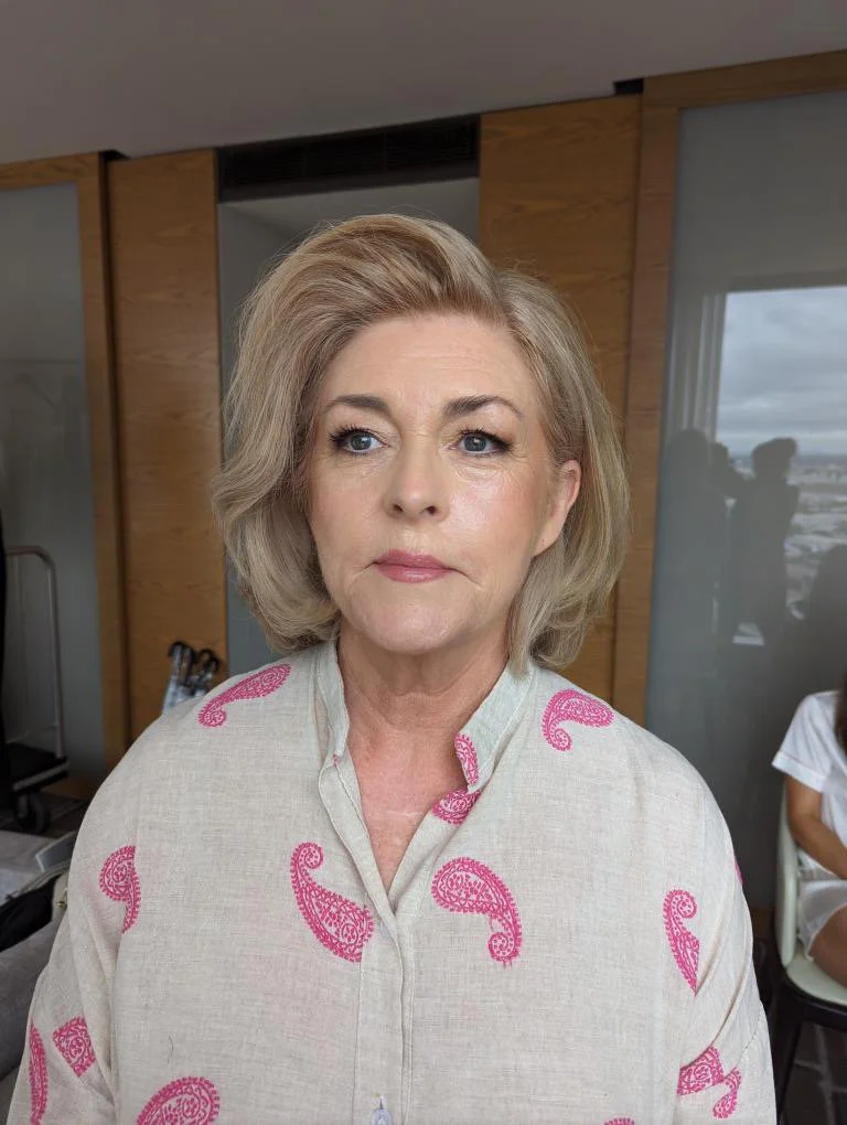mother of the bride after having her makeup professionally applied