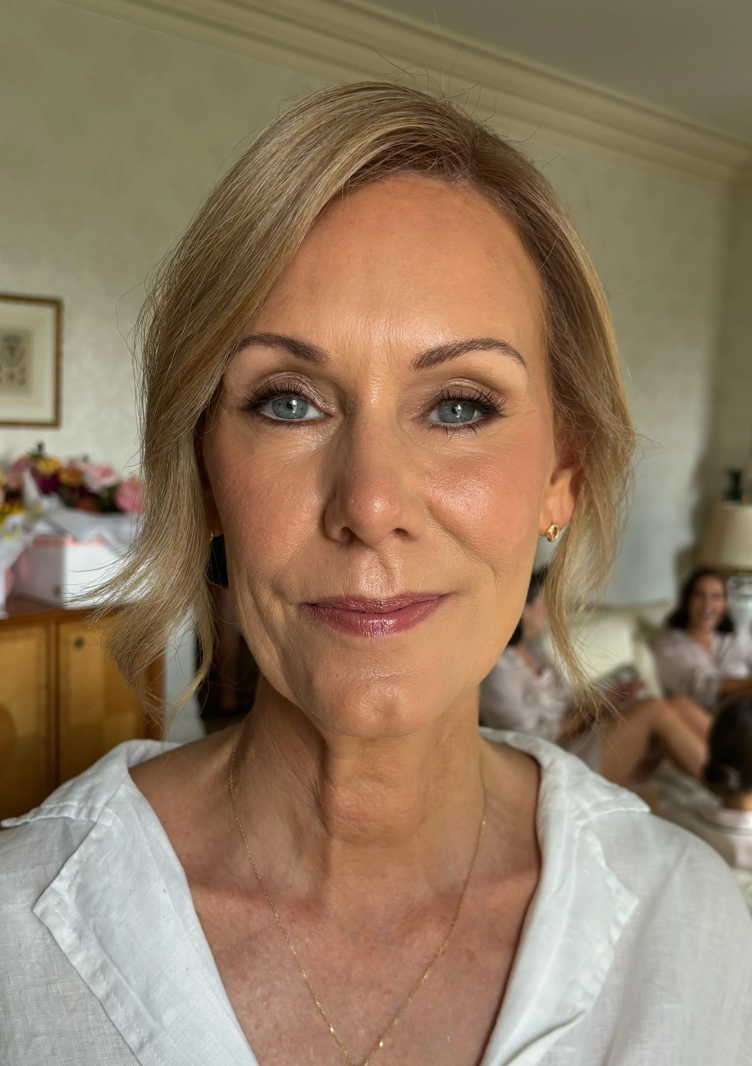 mother of the groom after having her makeup professionally applied
