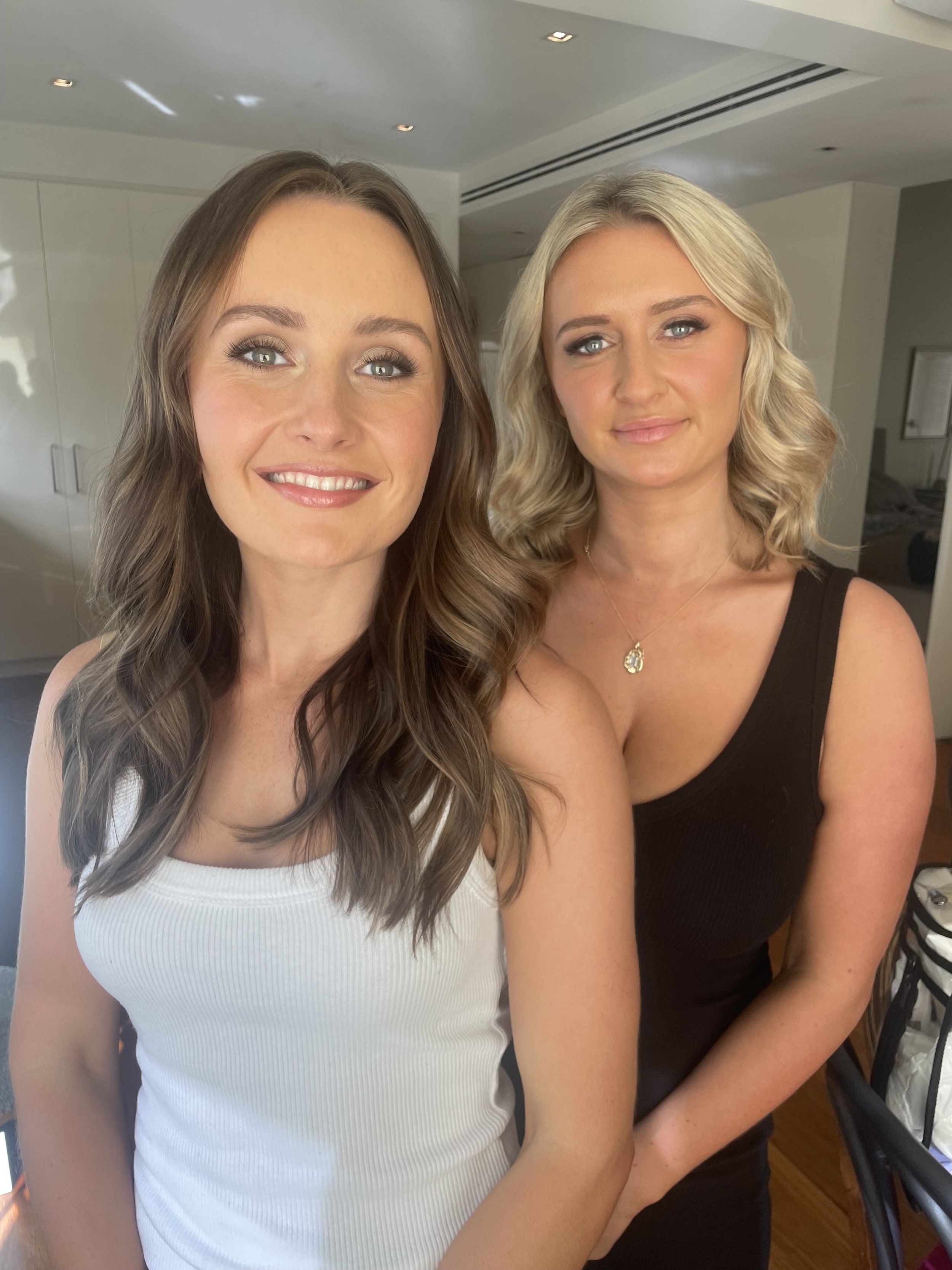 Two friends both with makeup professionally applied before heading to a 40th birthday party