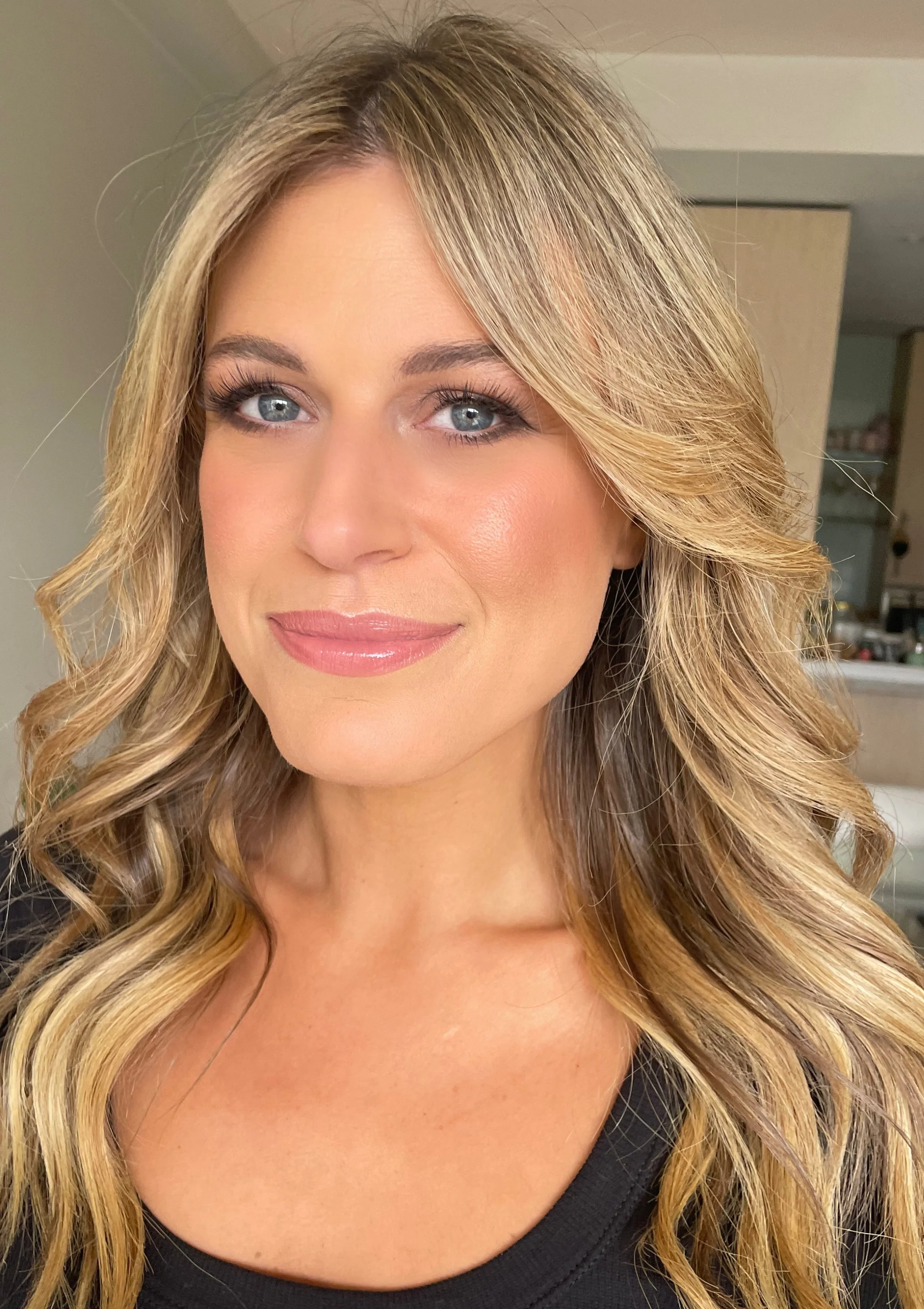 Woman with makeup professionally applied by Jessica O'Donnell