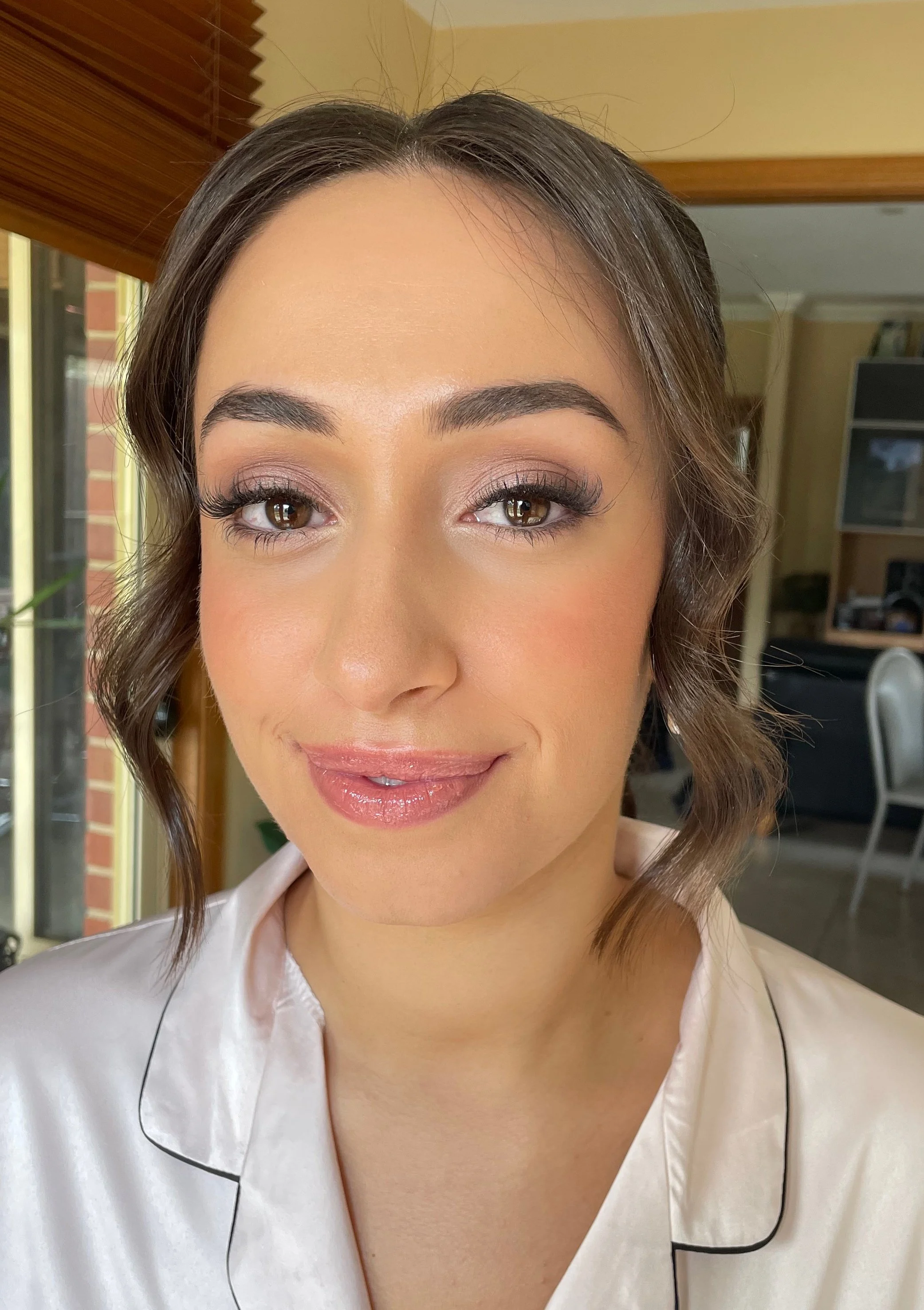 Soft curls and a fresh makeup look for this bride who has just had professional makeup applied by Jessica O'Donnell