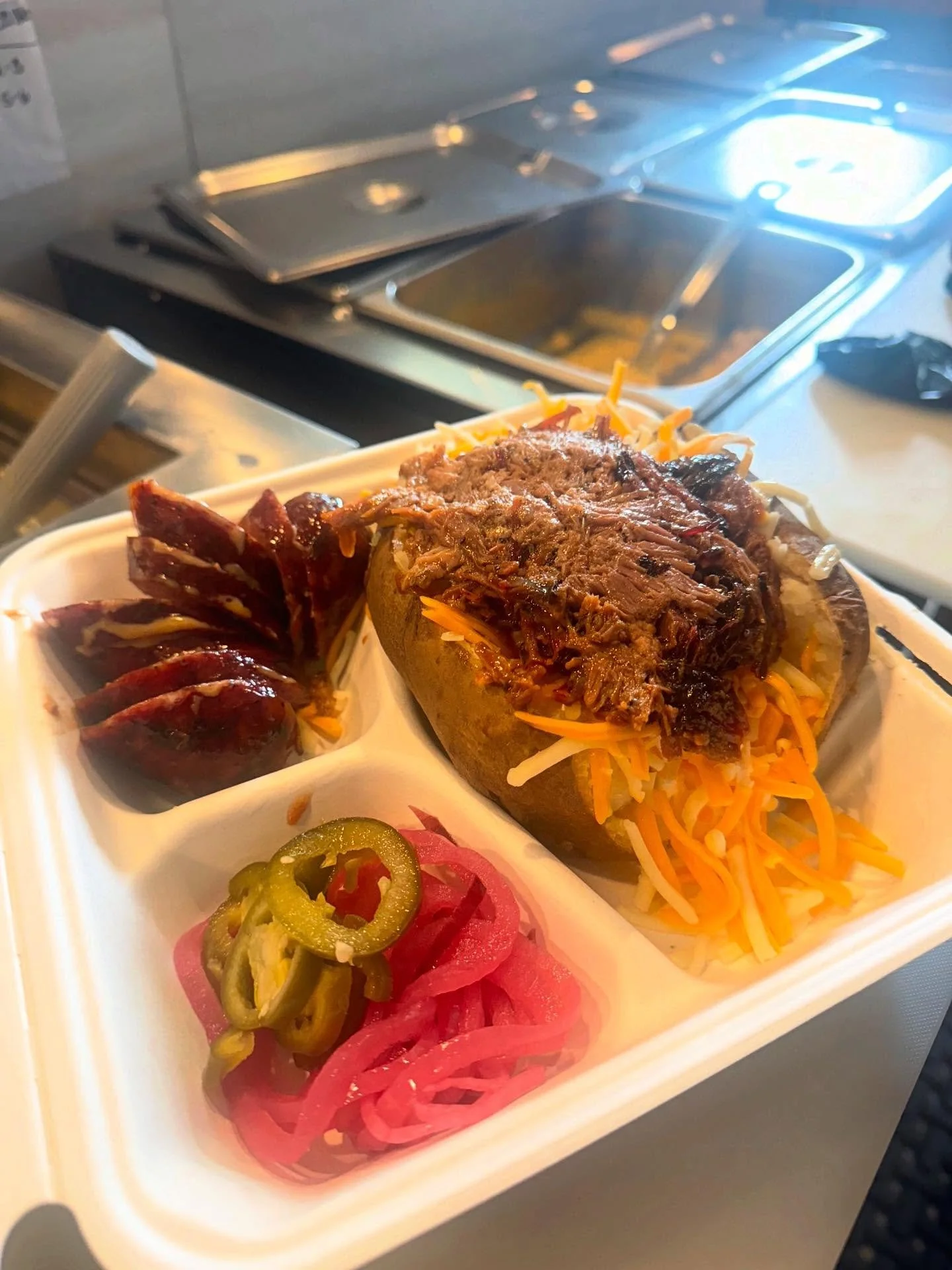 Out here making the Sunday Scaries not so scary anymore. 
Pictured: Brisket Tater (16) a link of jalape&ntilde;o cheese sausage (5.5) &amp; some fixins 👌

#couchpotato