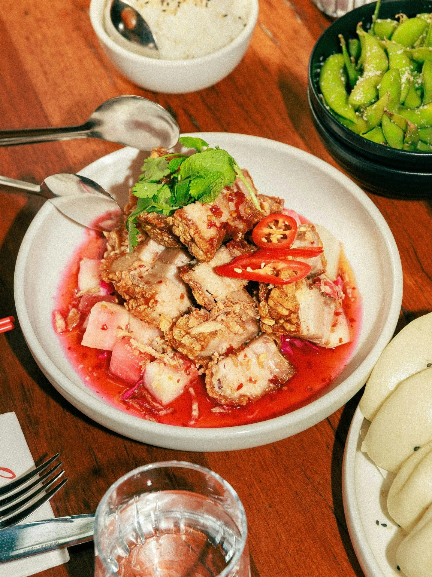 Crispy golden crackle, a rich chilli-cognac glaze, and pickled watermelon for that perfect balance 🌶️🥢

Our Cracklin&rsquo; Twice-Cooked Free-Range Pork Belly stars in the $49pp Wednesday* Banquet Baby, available every day (not just Wednesdays) 💋
