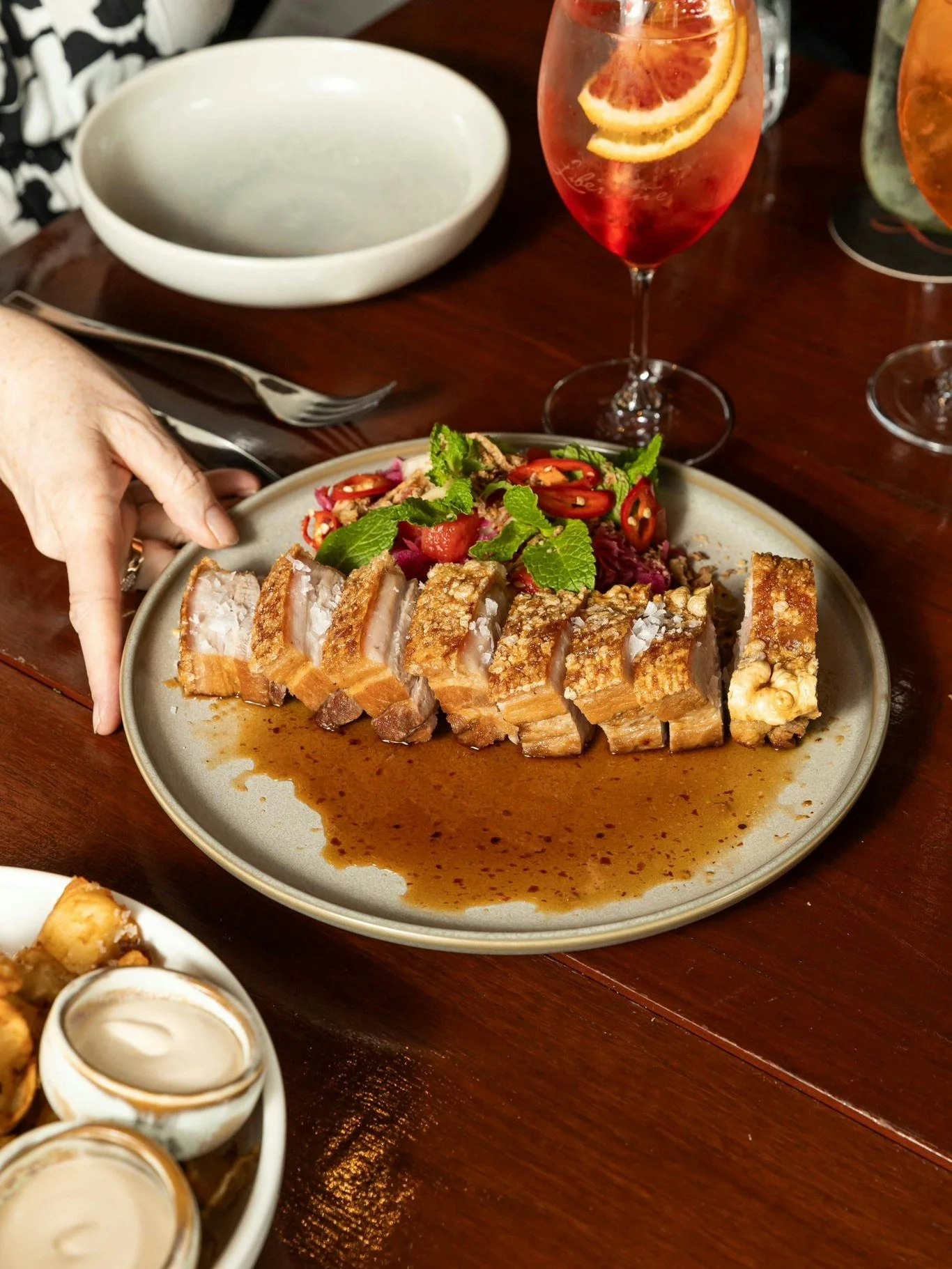 Cracklin&rsquo; Twice-Cooked Free-Range Pork Belly ~ crispy, rich and absolutely non-negotiable 🤤🔥 Served with Chilli &amp; Cognac Glac&eacute;, Fermented Red Cabbage and Fresh Mint.

Part of the Wednesday Banquet, Baby! ~ $49pp daily 🥢 Add a Bolt