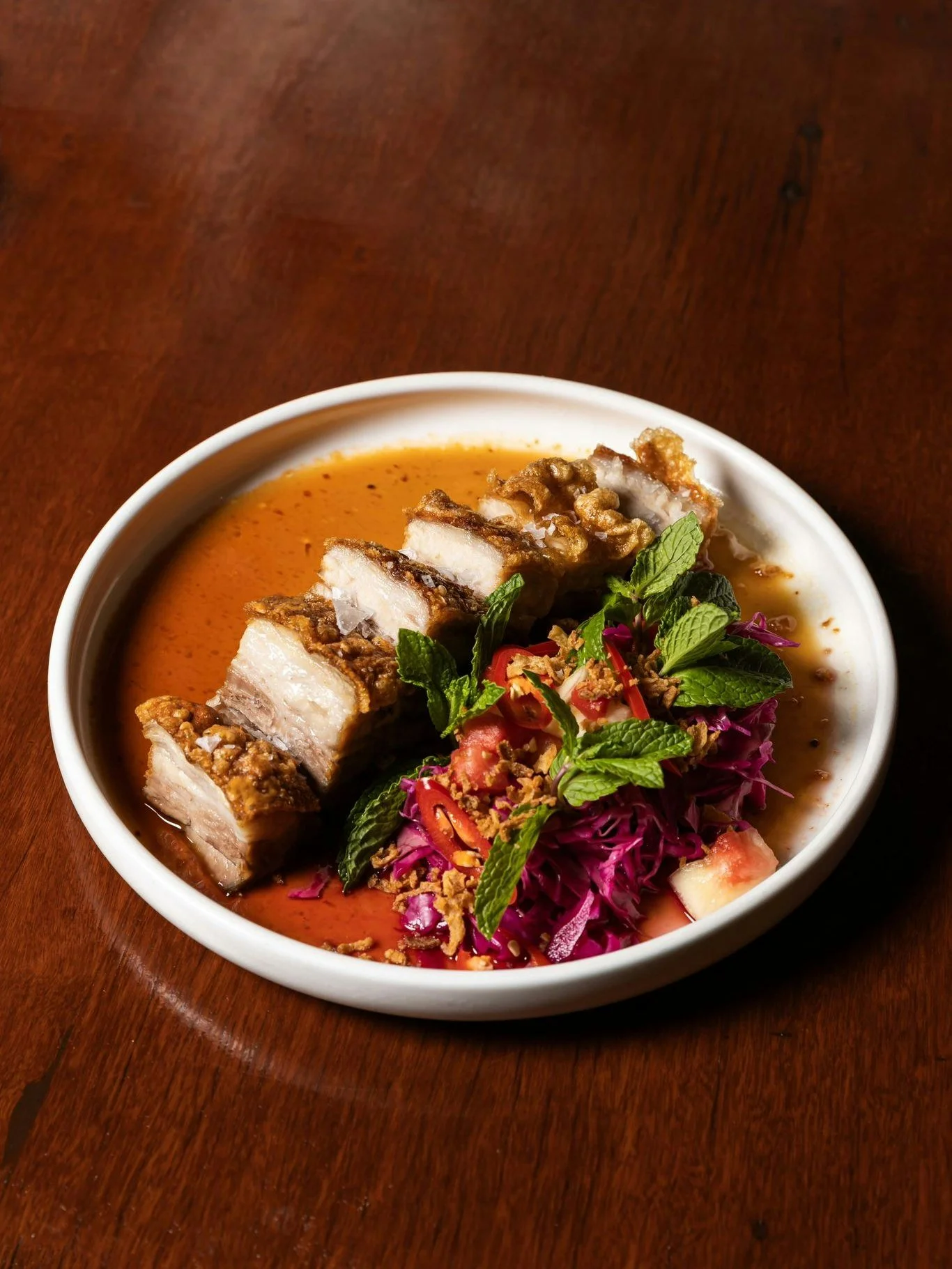 End your weekend on a high 💃🔥

Cracklin&rsquo; Twice-Cooked Free-Range Pork Belly ~ crisp crackling, tender layers and bold flavour with Chilli &amp; Cognac Glac&eacute;, Fermented Red Cabbage and Fresh Mint 🤤

Final day to Bolt-On for the week ~ 