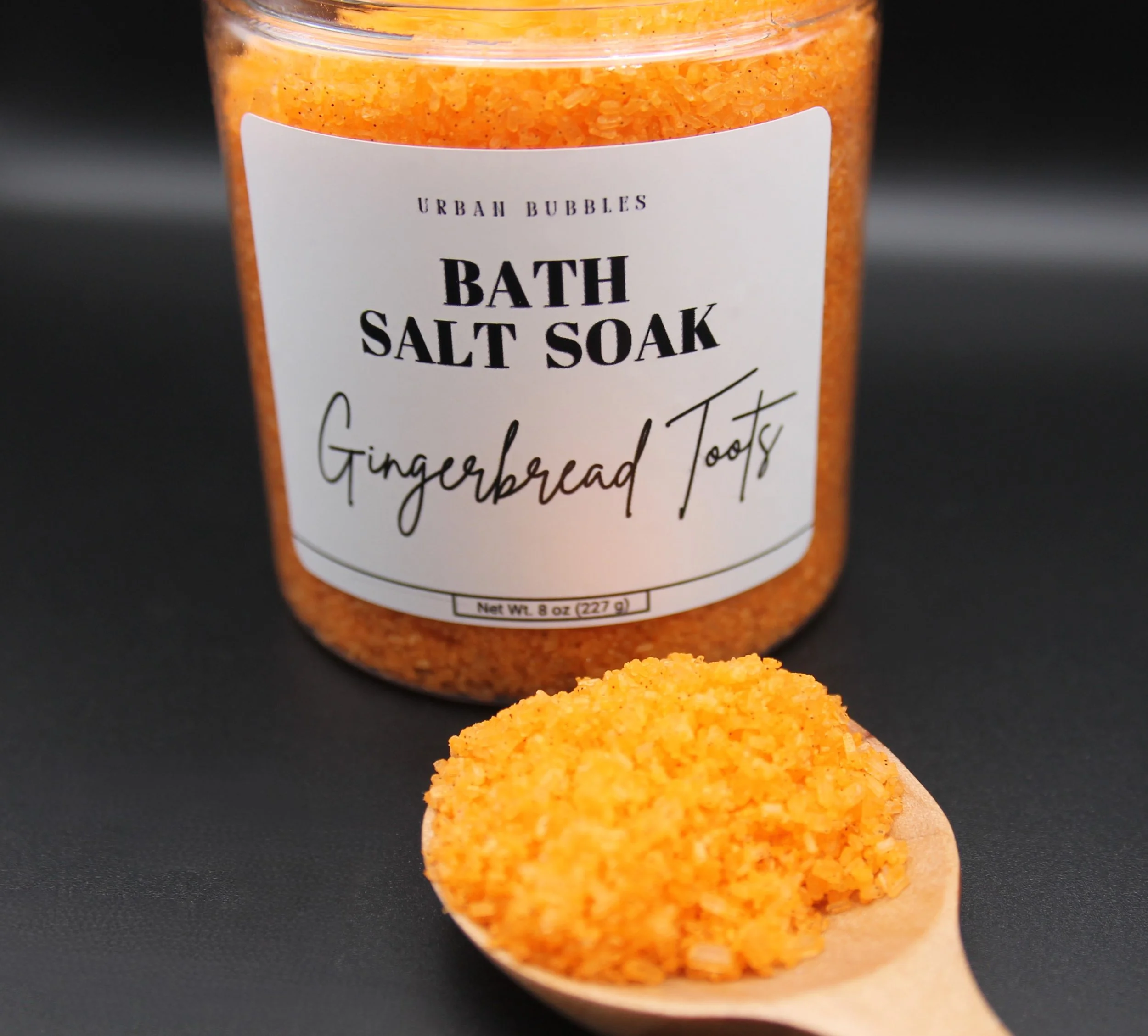 Gingerbread Toots Bath Salts in soft golden hues, infused with the warm and spicy aroma of butter, cinnamon, clove, nutmeg, and vanilla, perfect for a relaxing holiday bath.