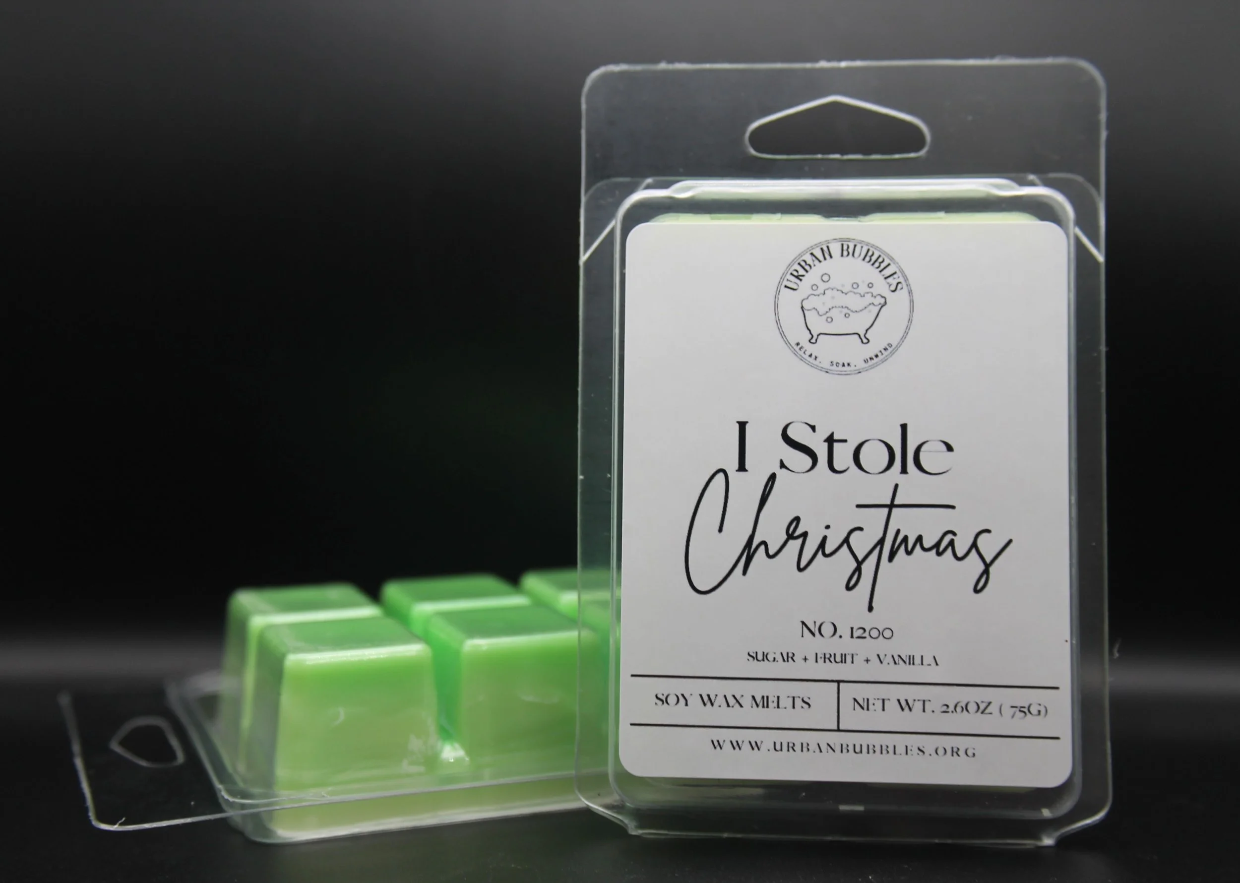I Stole Christmas Wax Melt in cheerful green tones with a sweet and playful fragrance of vanilla, sugar, and light fruity notes, perfect for adding holiday magic to your space.