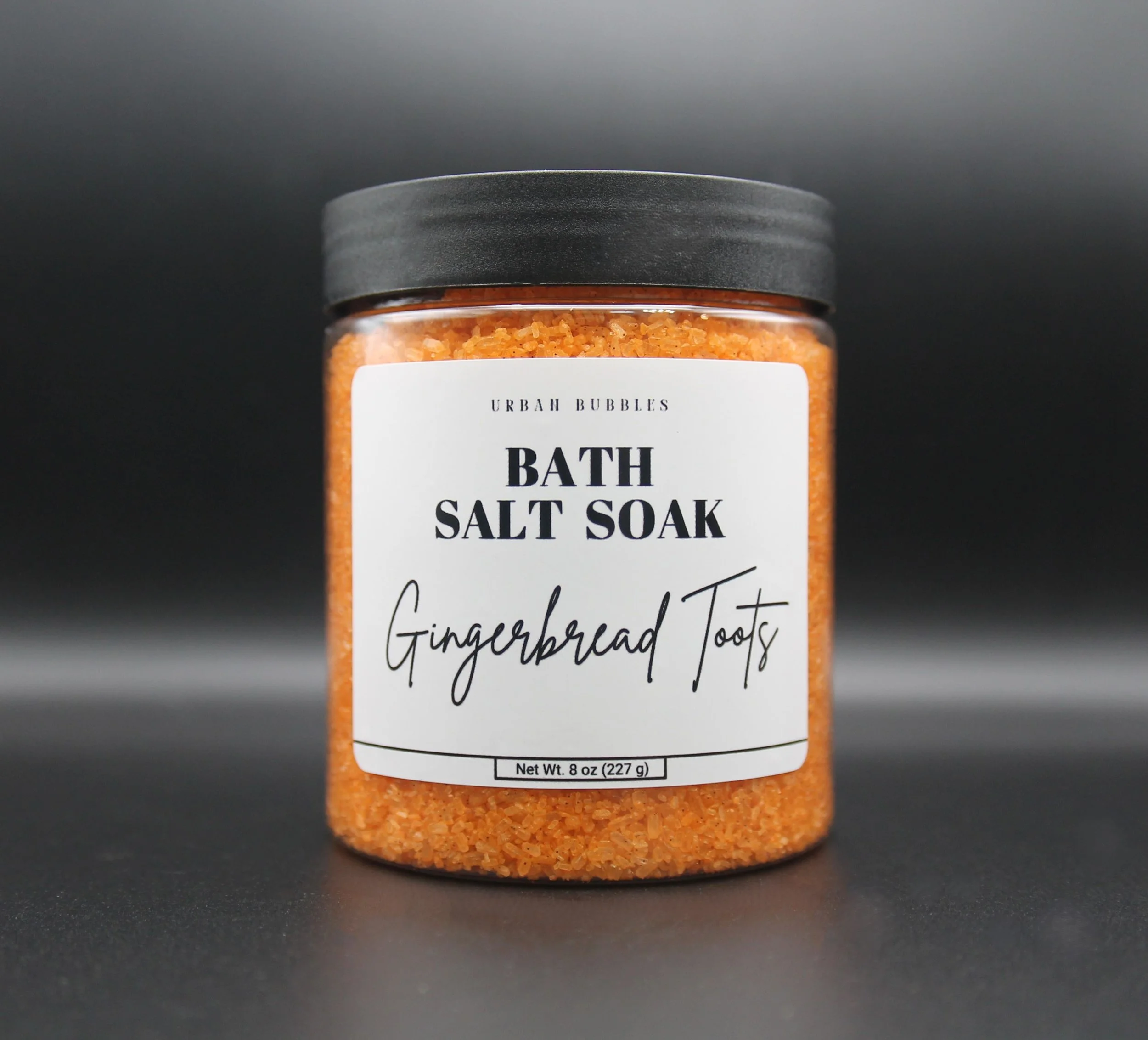 Gingerbread Toots Bath Salts in soft golden hues, infused with the warm and spicy aroma of butter, cinnamon, clove, nutmeg, and vanilla, perfect for a relaxing holiday bath.