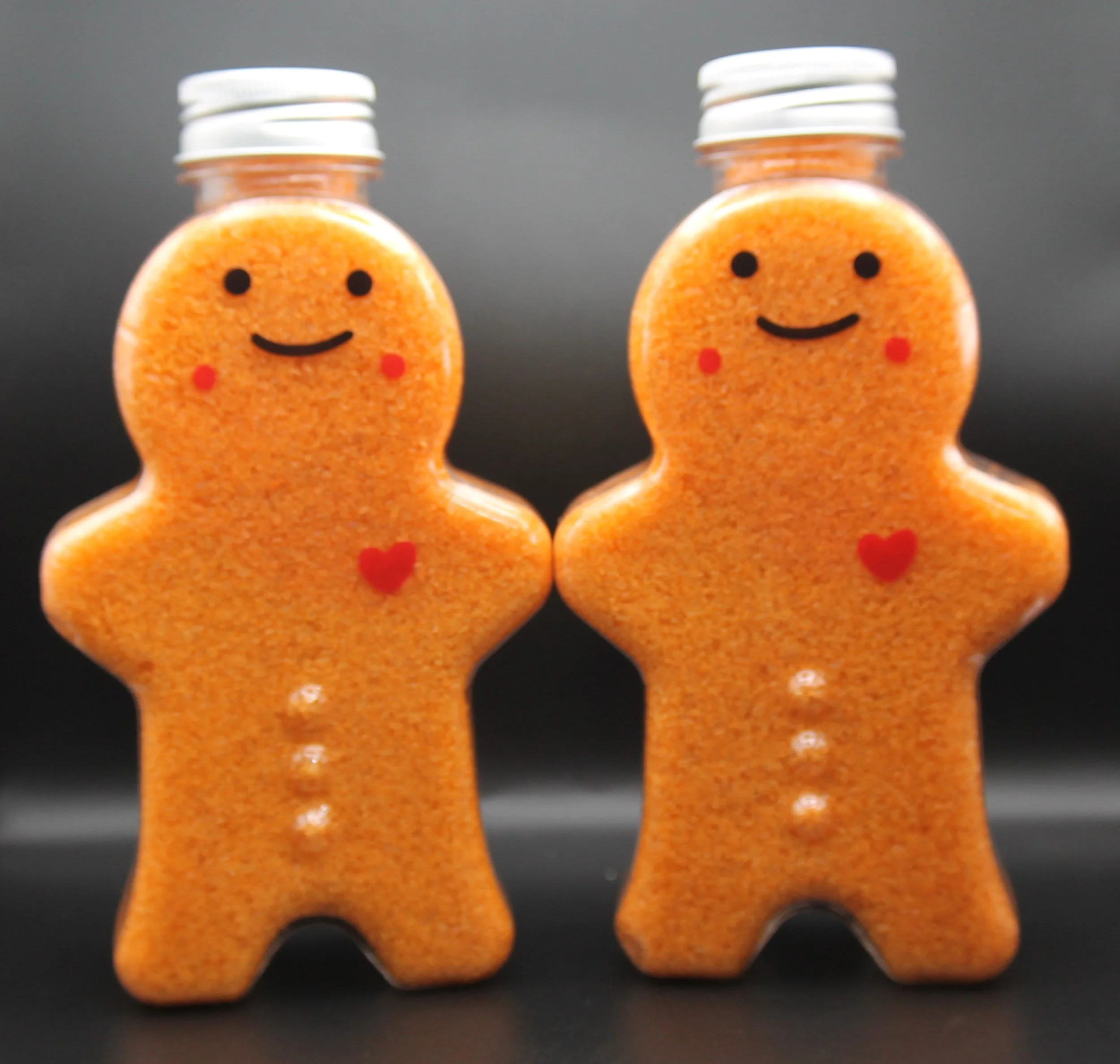 Gingerbread Toots Bath Salts in soft golden hues, infused with the warm and spicy aroma of butter, cinnamon, clove, nutmeg, and vanilla, perfect for a relaxing holiday bath.