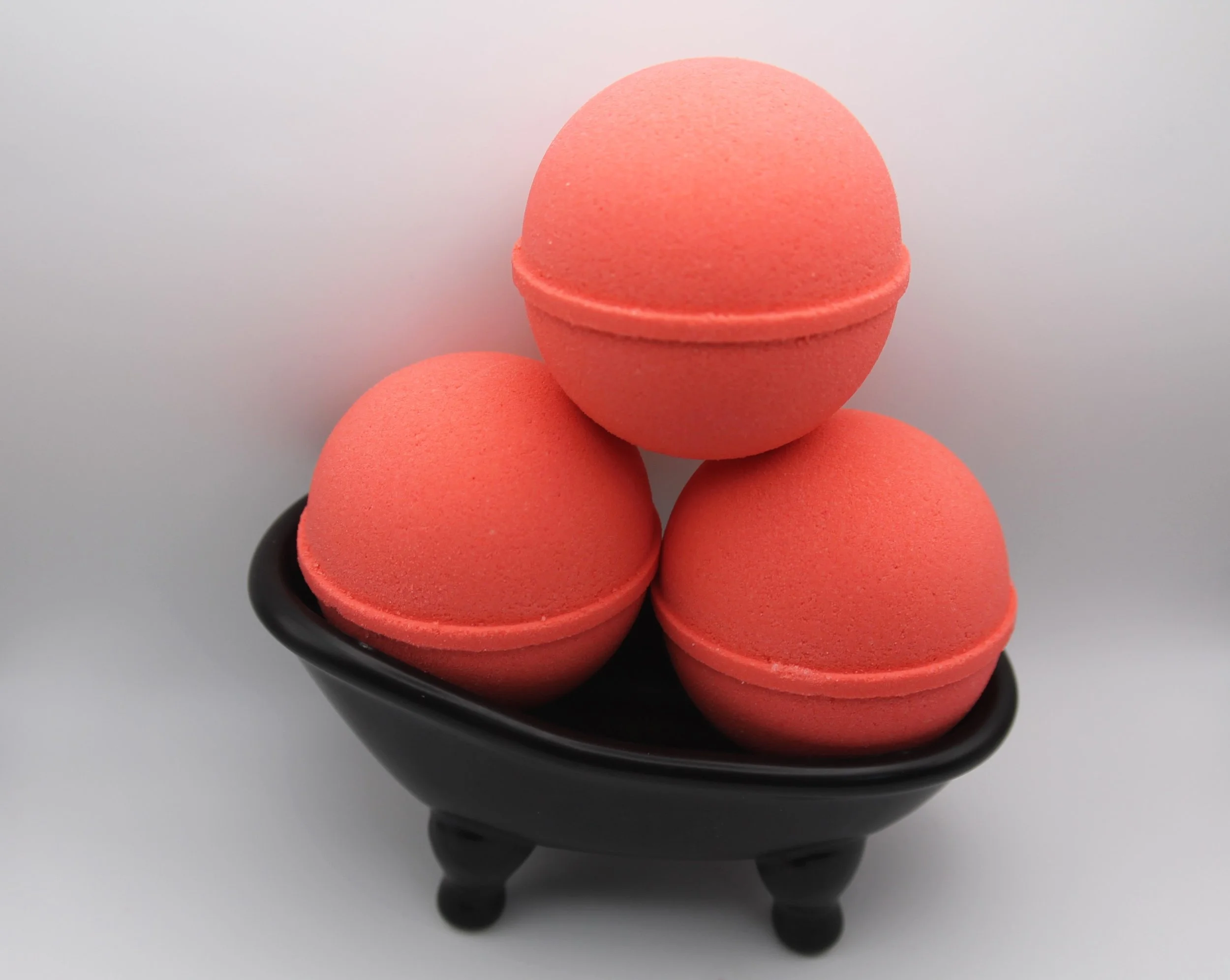 Sunday Mornings Bath Bomb with a nostalgic scent of citrus, mixed berries, and vanilla, evoking joyful childhood memories.