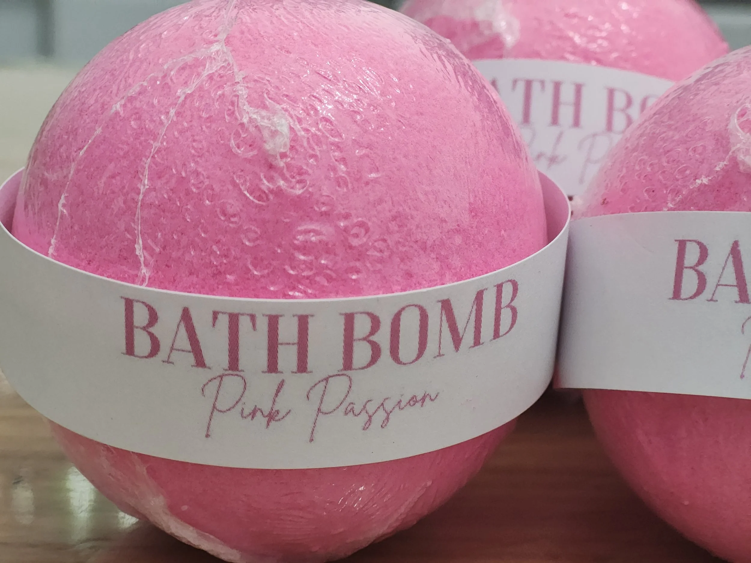 Pink Passion Bath Bomb in vibrant tones with a sweet and refreshing fragrance of strawberry, melon, dragonfruit, and vanilla, perfect for a joyful bath experience.