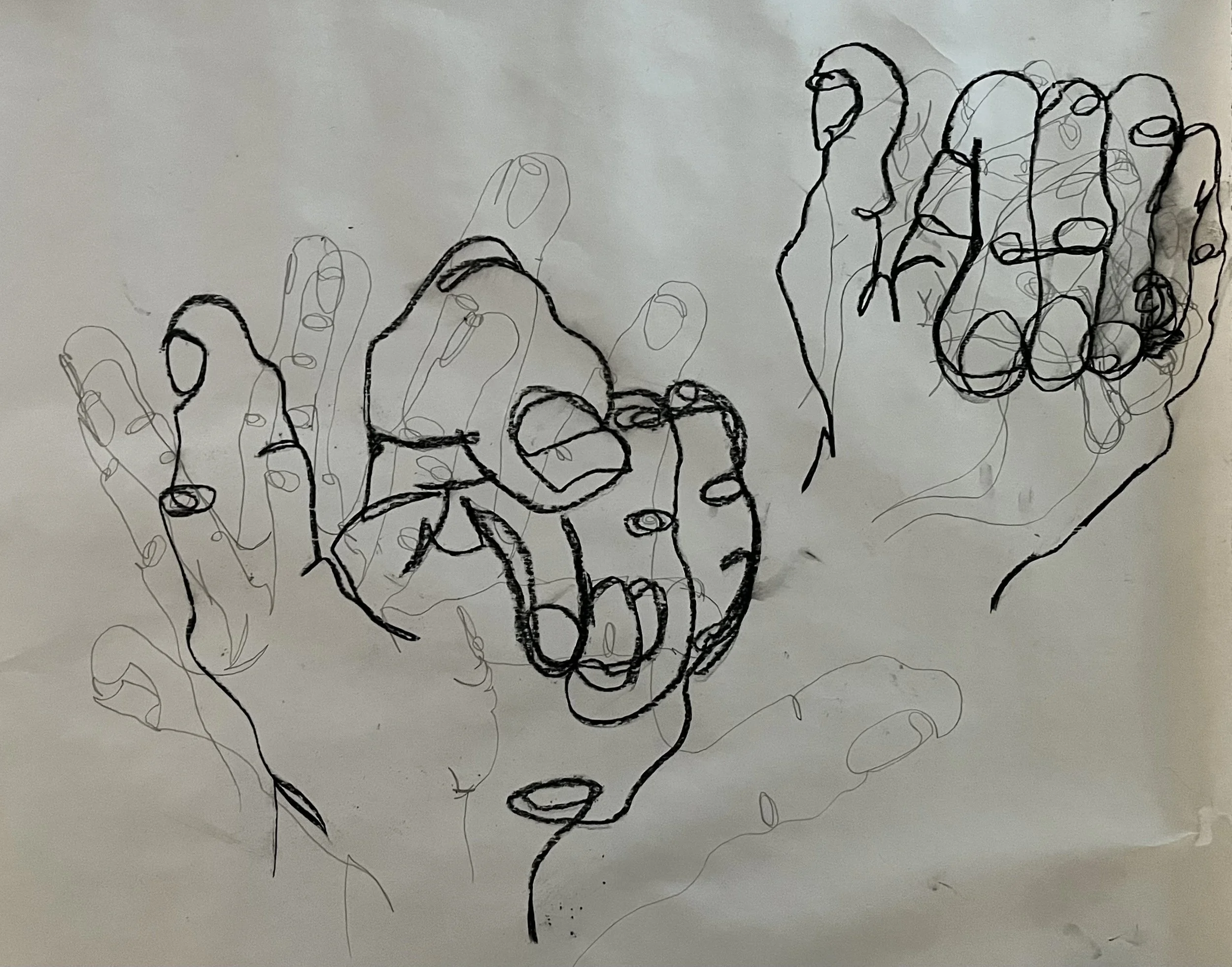 Sketch of two hands with a continuous line drawing style on white paper.