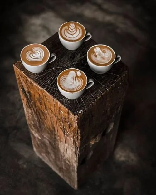 Four coffees on wooden stand
