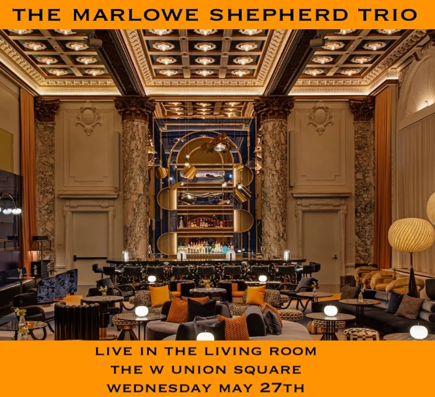 Interior of a luxurious bar or lounge with intricate ceiling designs, marble columns, modern lighting fixtures, and a variety of seating arrangements with cushions and tables. The scene is warmly lit and stylishly decorated.