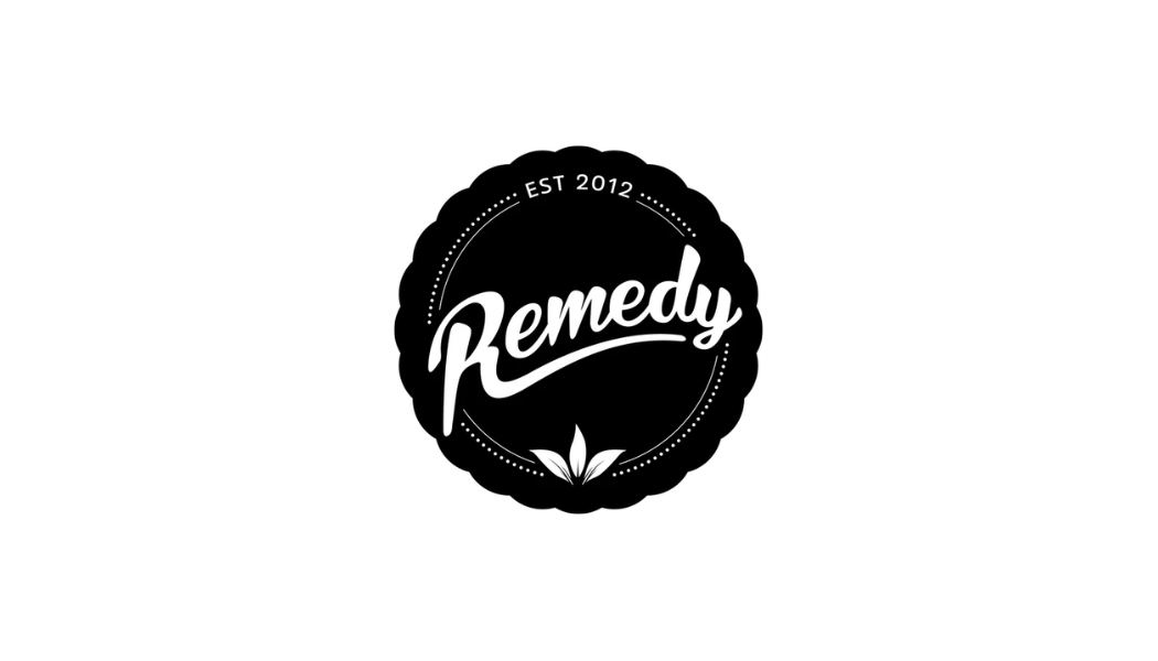 Black circular logo with the word 'Remedy' in white cursive lettering, EST 2012 at the top, and a small leaf design at the bottom.