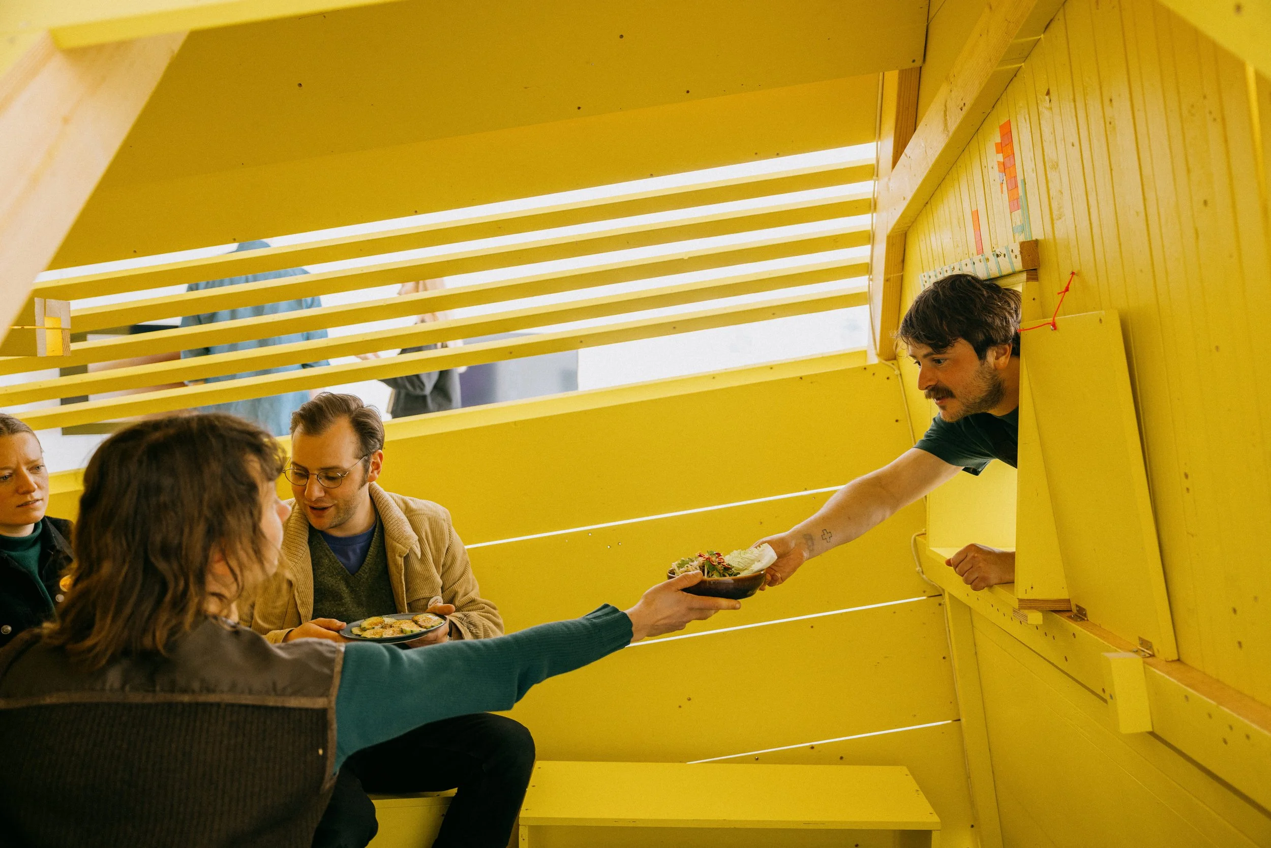 Fergus Tibbs artist interacting with guests in his art installation titled hosting infrastructure