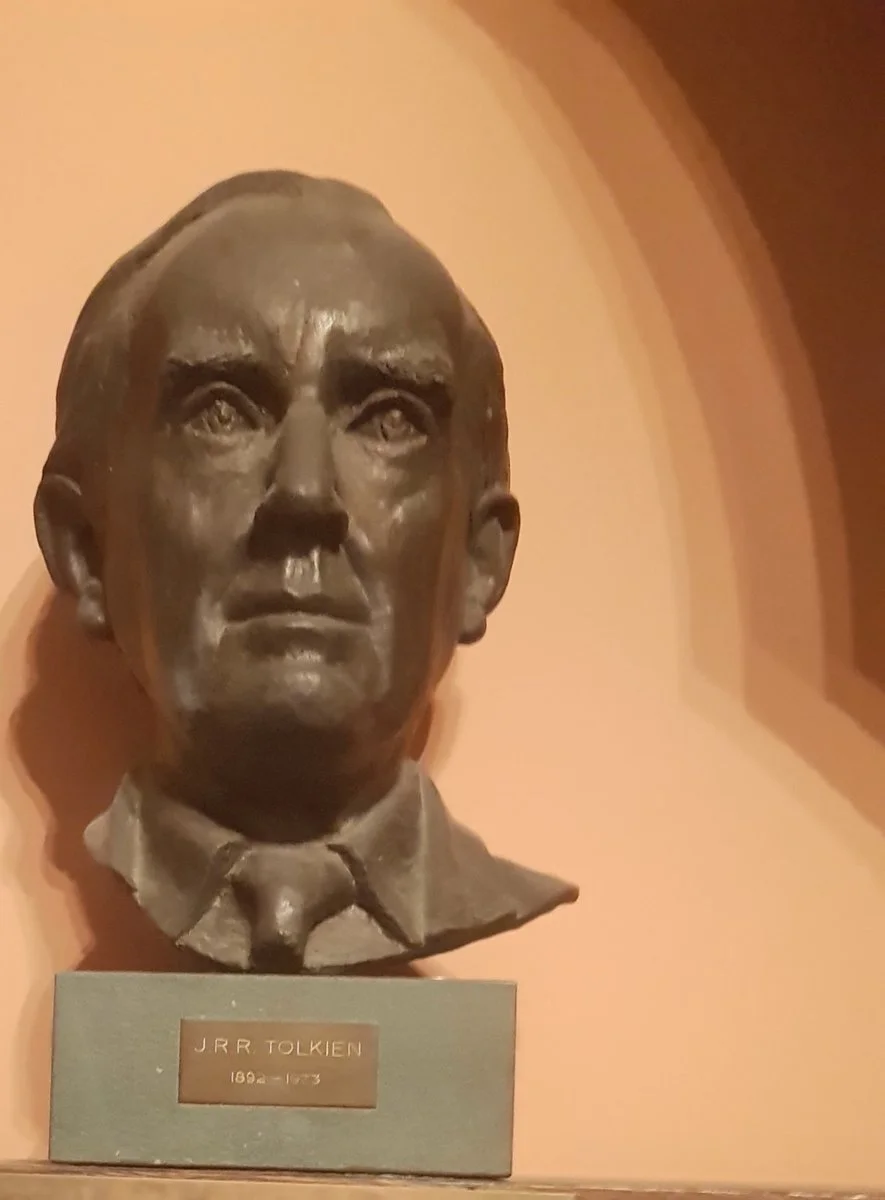 Bronze bust of J.R.R. Tolkien with a plaque that reads 'J R R Tolkien 1892 - 1973'.