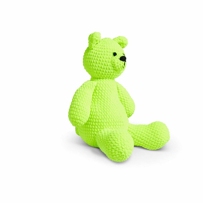 Color changing textured teddy bear with black eyes and nose on a white background.