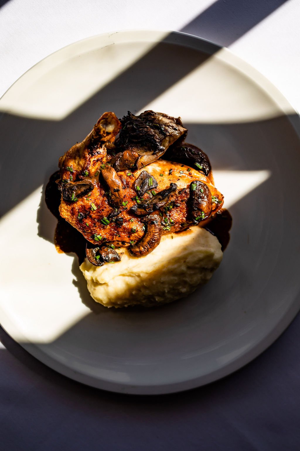 the best chicken marsala in Texas on a bed of mashed potatoes