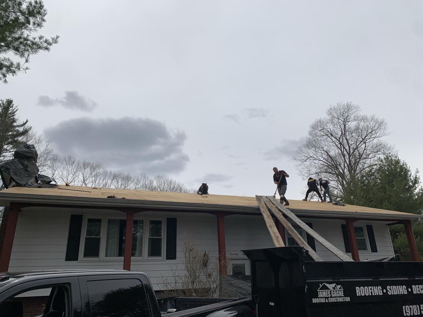 Band of Brothers LLC hard at work today replacing a roof for a customer who is selling his home.