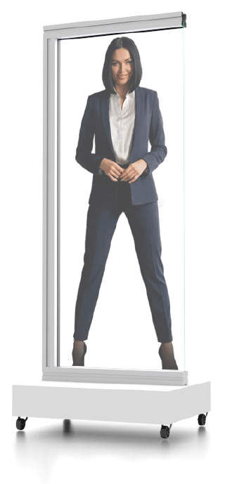 A woman in a navy blue business suit stands inside a portable photo booth with a white background.