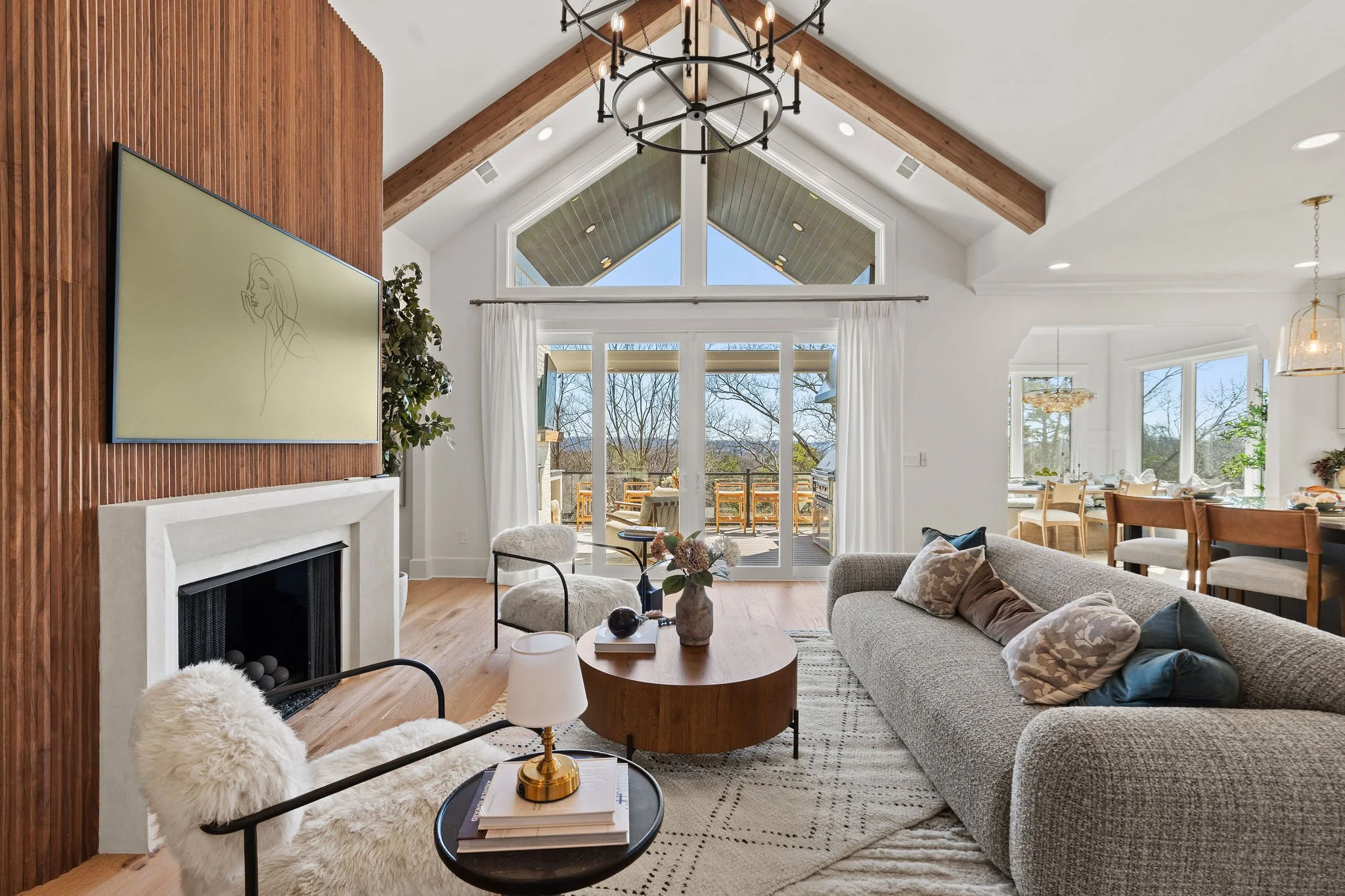 Stunning modern living room by a luxury home builder in Chattanooga TN, featuring vaulted ceilings, natural light, and custom craftsmanship in a North Shore custom home.