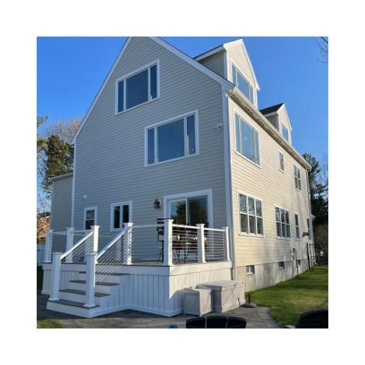Oranssi technician working on a roof project