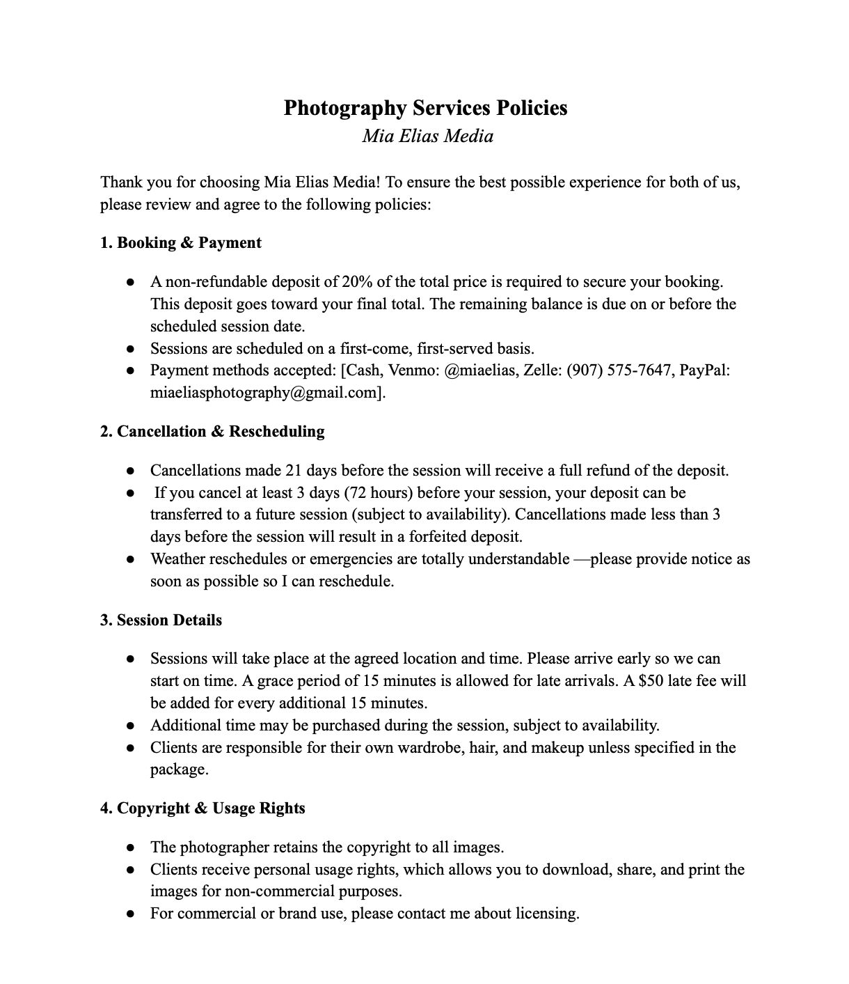 Photograph of photography services policies document outlining booking, cancellation, session details, and usage rights.