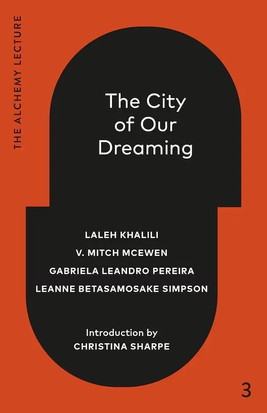 Book cover with a black pill-shaped graphic containing the title "The City of Our Dreaming" and author names, Laleh Khalili, V. Mitch McEwen, Gabriela Leandro Pereira, Leanne Betasamosake Simpson, and an introduction by Christina Sharpe, on an orange